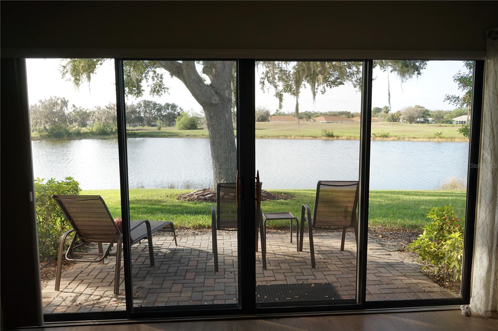 sliders out to patio and water view