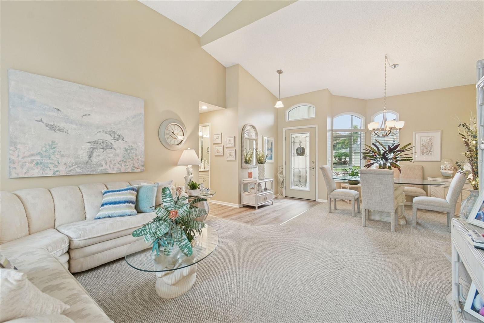 living room towards dining room looking at front door