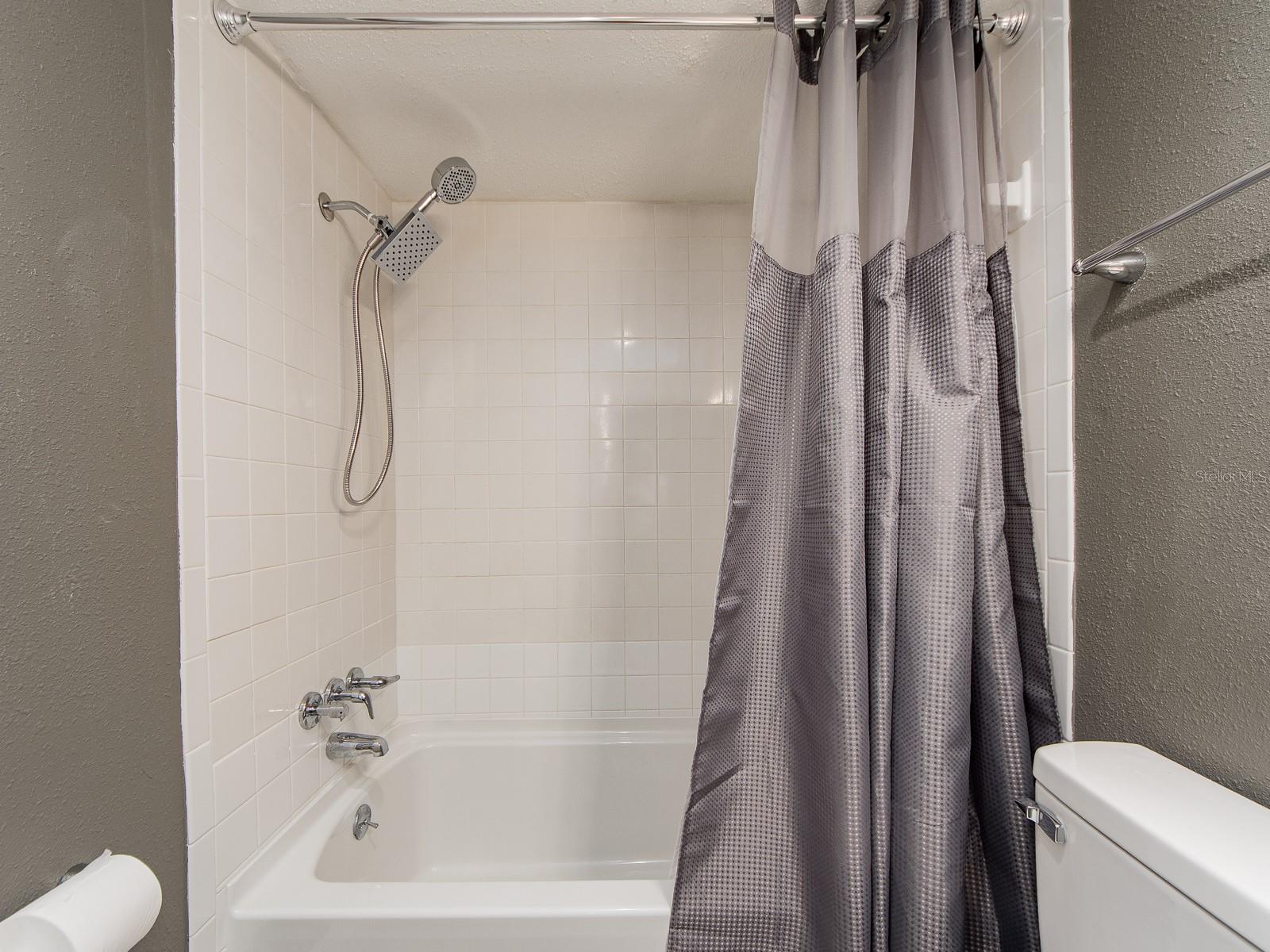 Bath with shower and tub