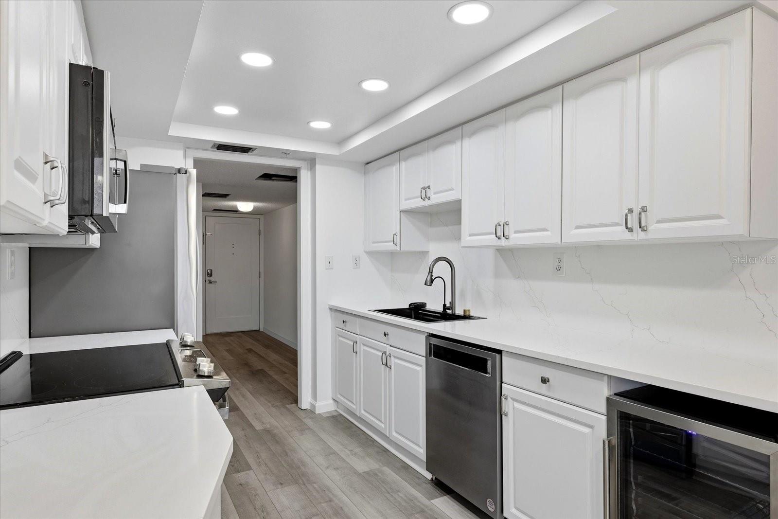 Kitchen w/ dishwasher and wine refridgerator