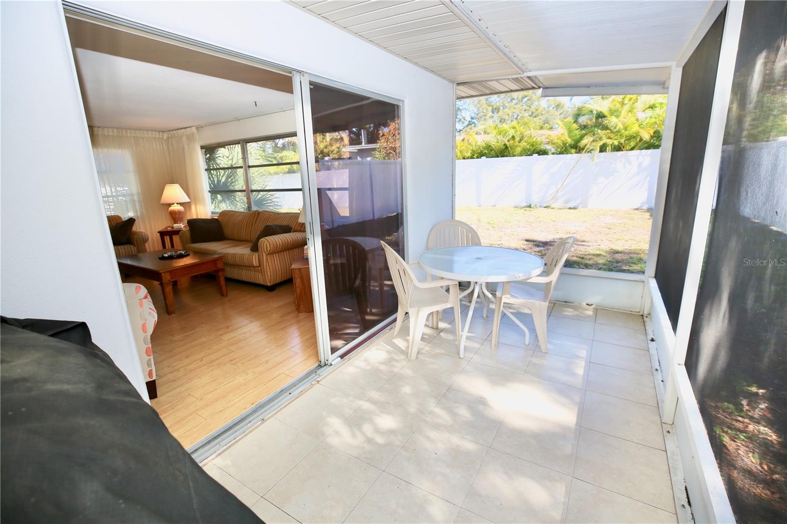 Enclosed patio adjacent to family room