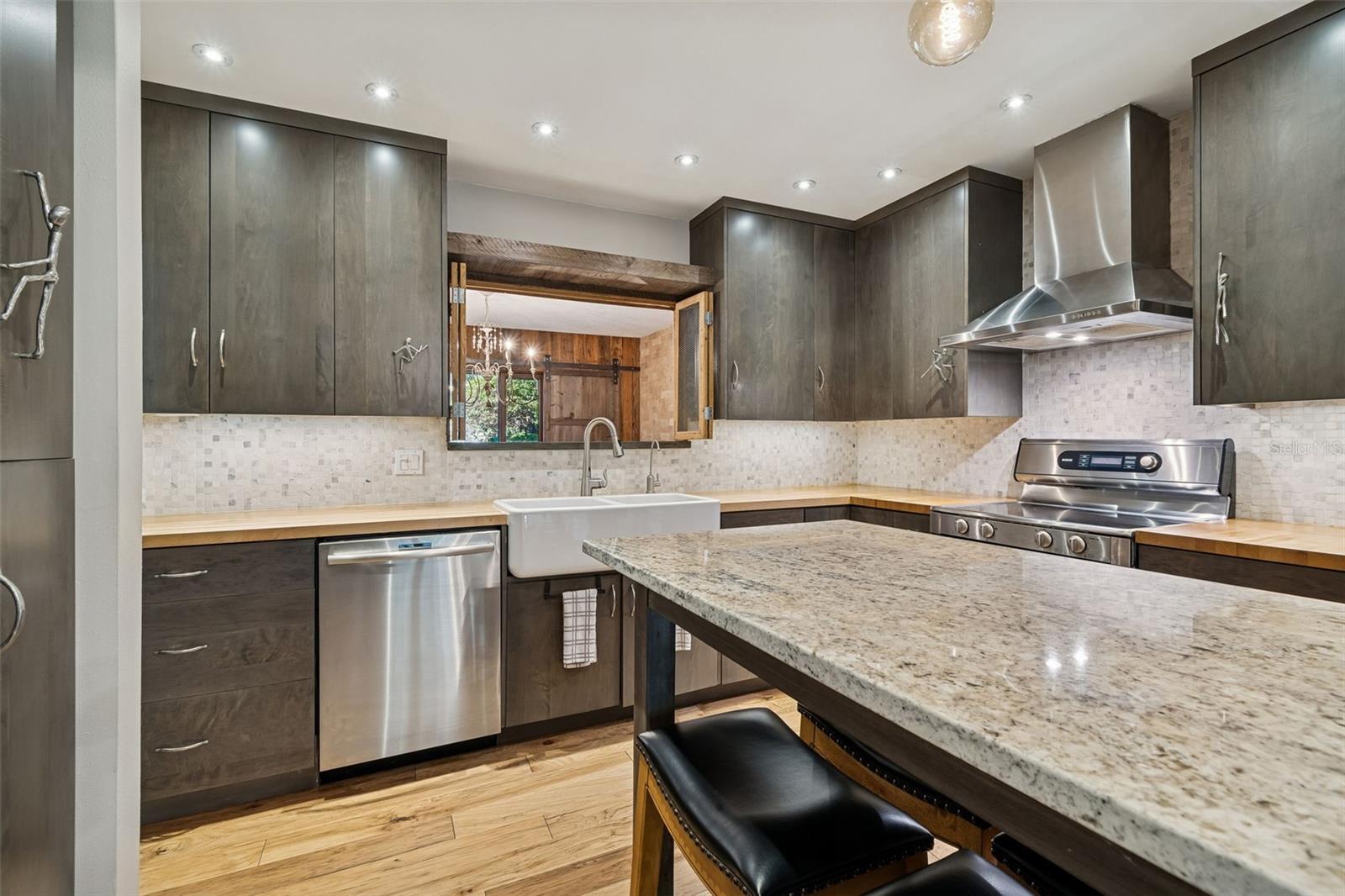 Custom kitchen with pass-thru to dining