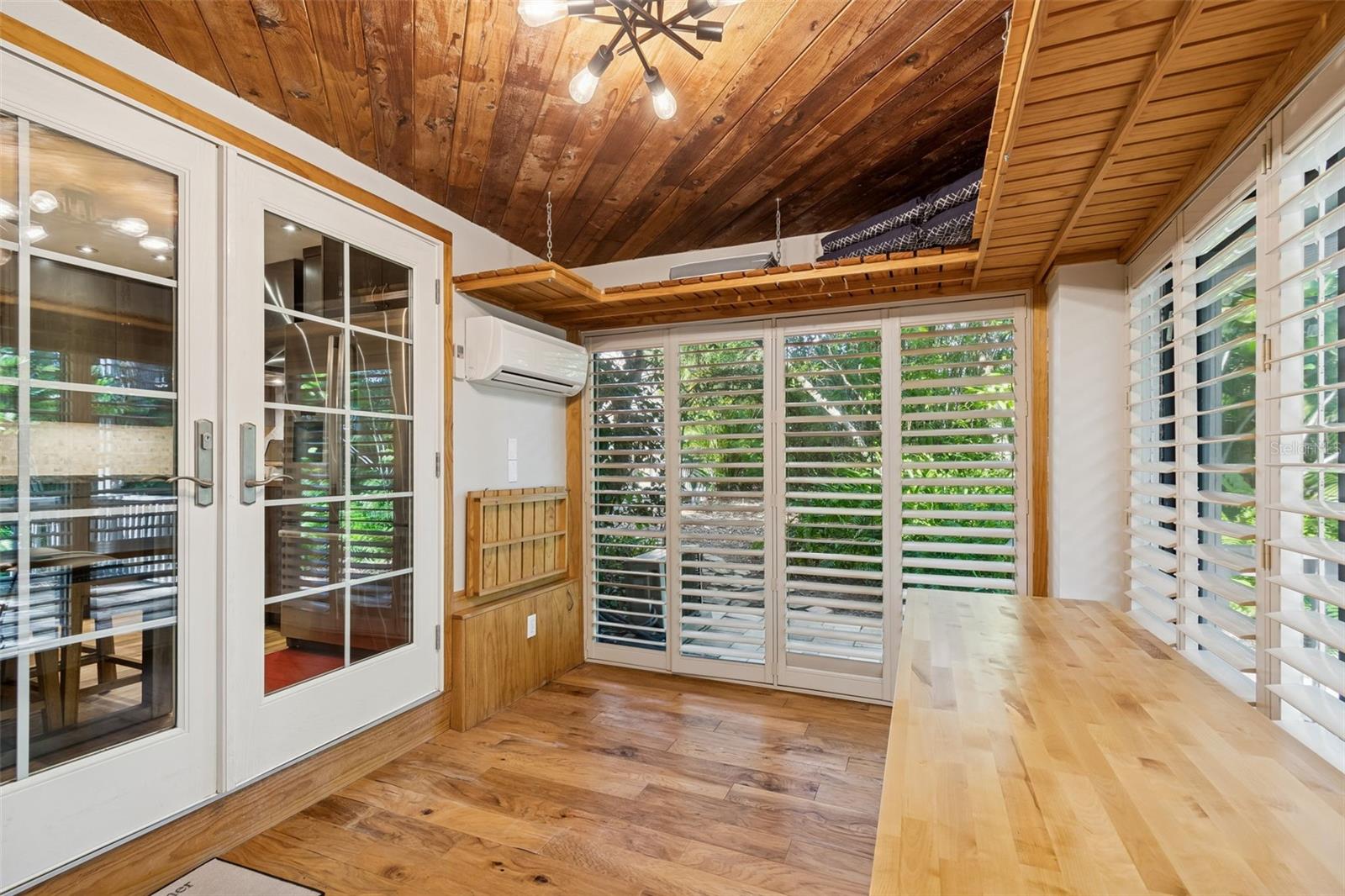 Breakfast/Sun room to sliders to side stone patio