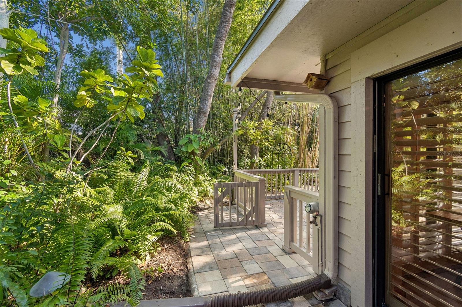 Access to side patio from back deck/patio area
