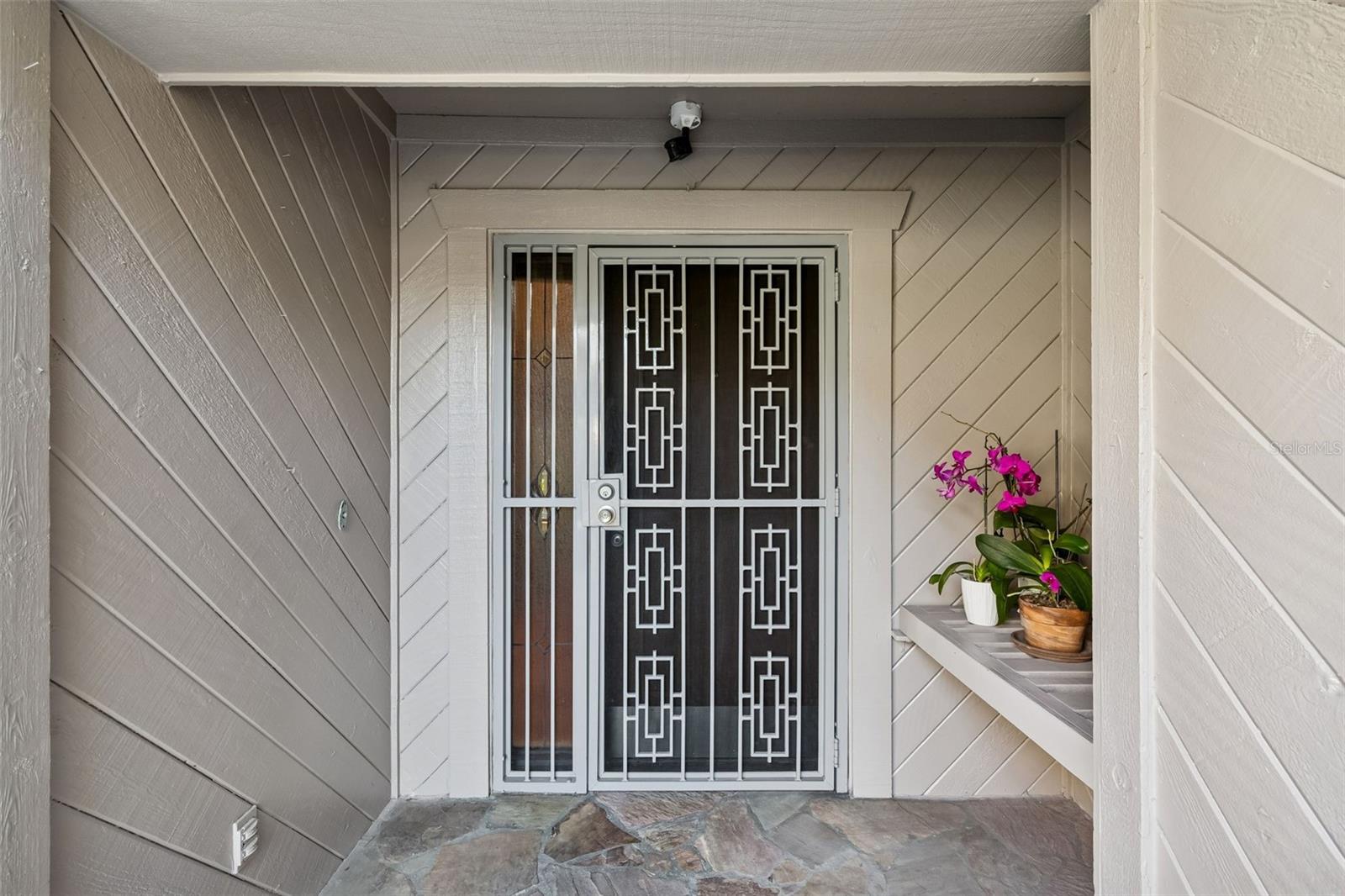 Covered entry with bench and screen door
