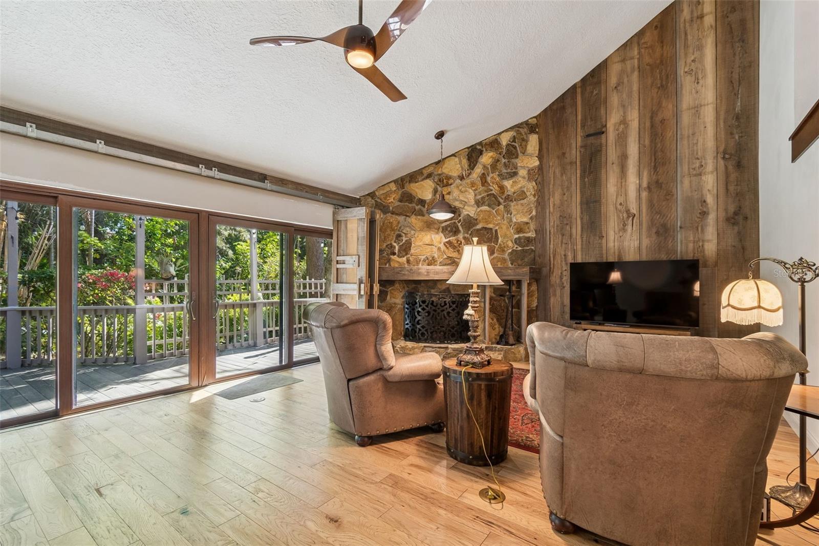 Family Room with FP, wall of sliders to private back deck