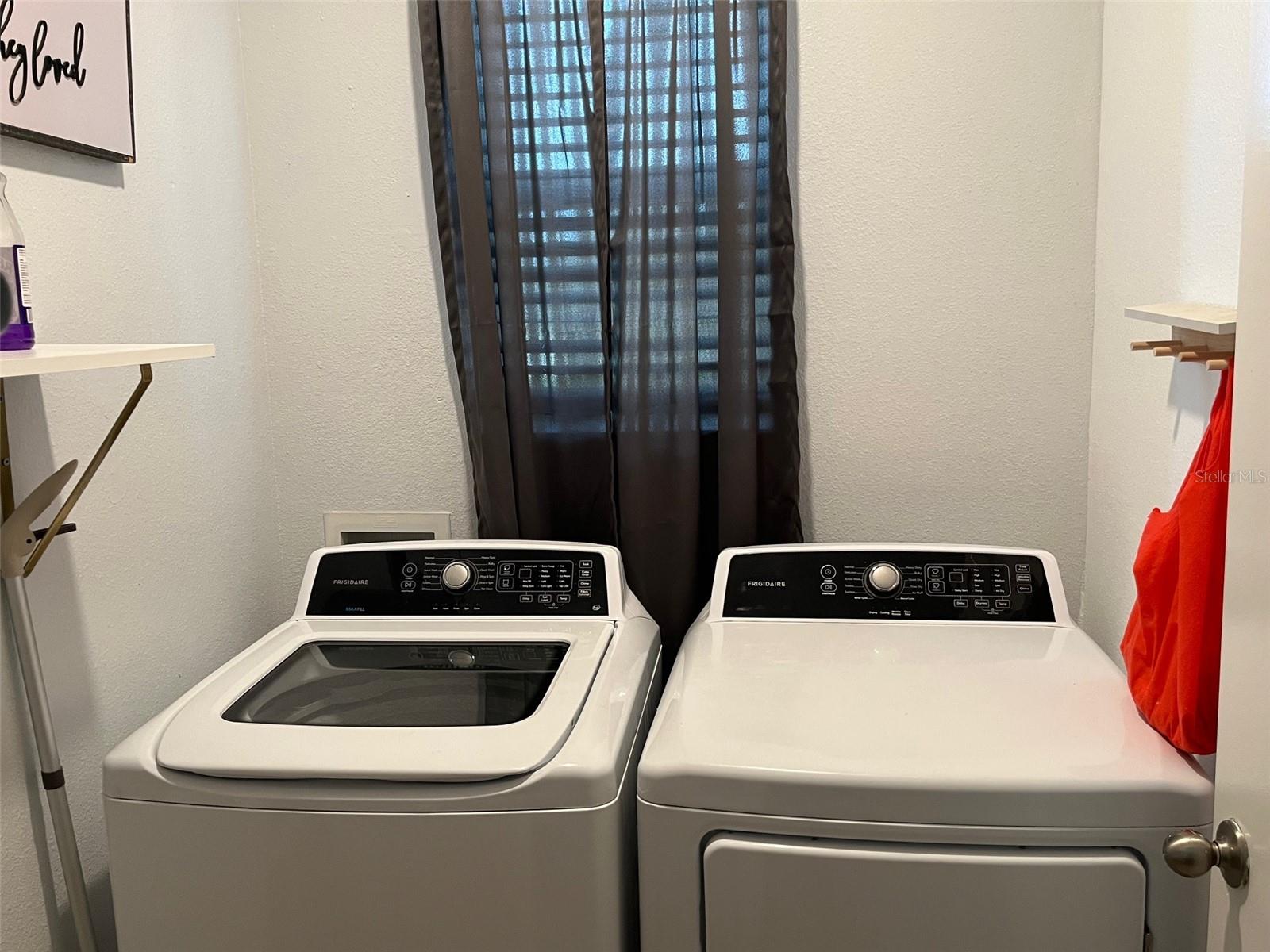 separate laundry room with included washer and dryer