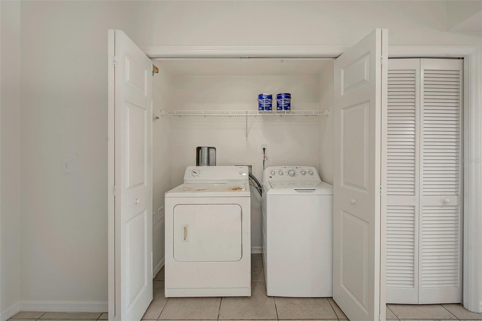 View of washer and dryer in closet
