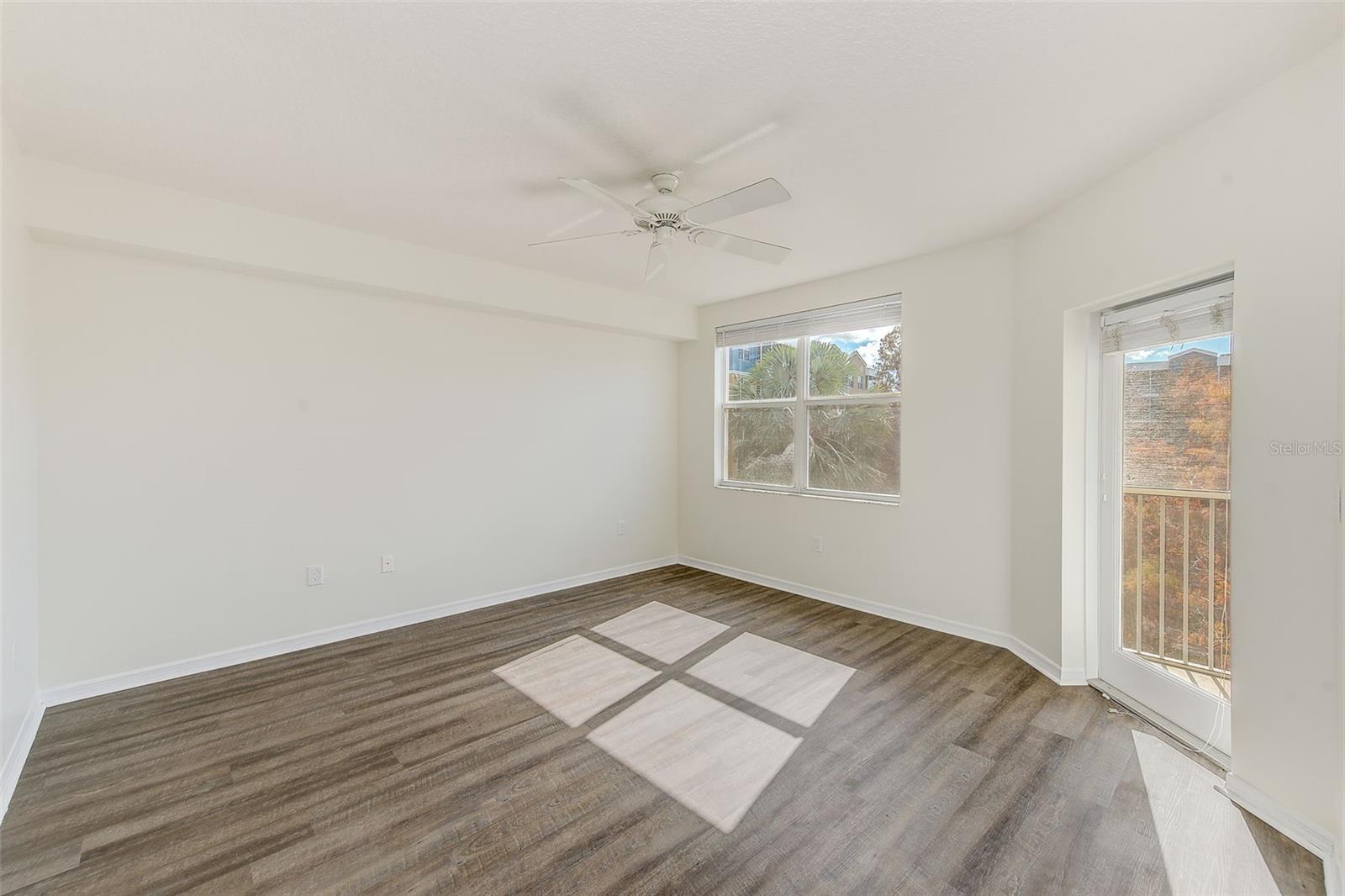 View of master bedroom with door to screened lanai