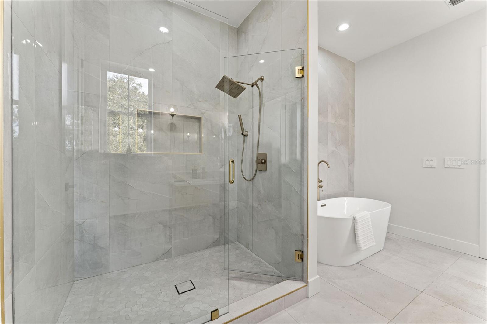 Walk in shower with frameless enclosure