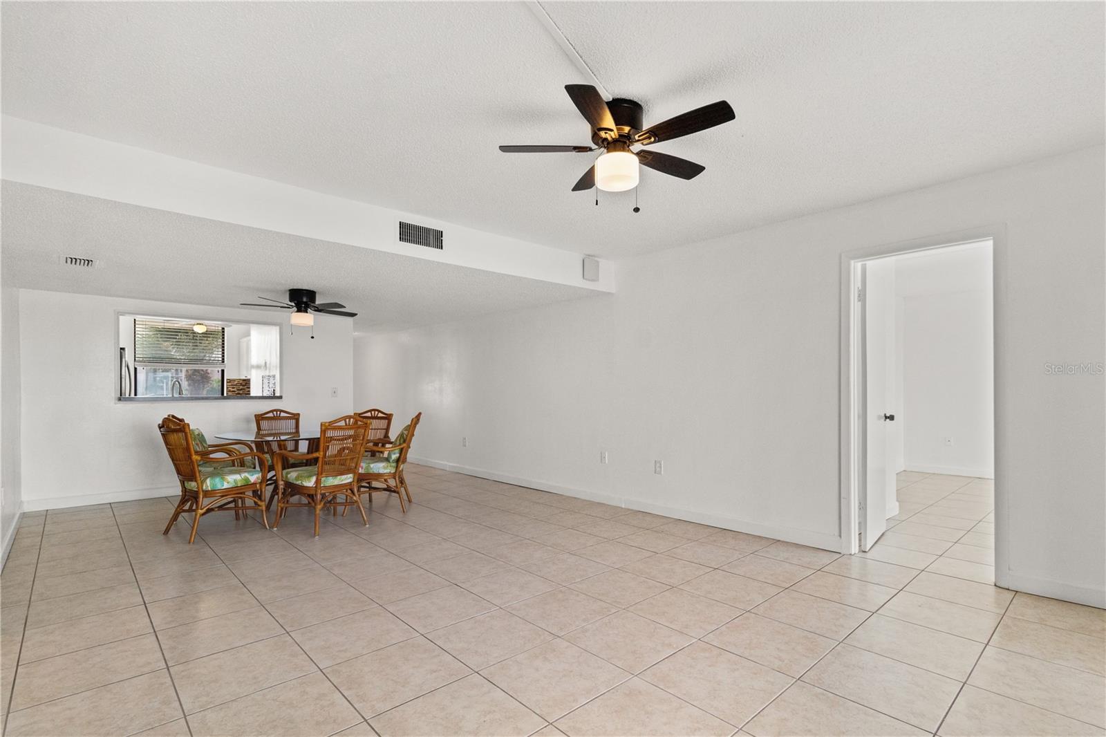 Dining area and door into primary bedroom