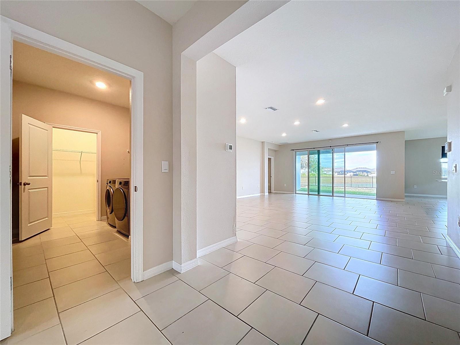 LAUNDRY ROOM & GARAGE TO THE LEFT OF THE FOYER