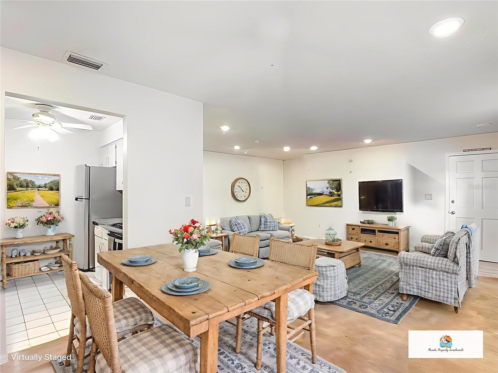 Staged dining and living room and table in kitchen