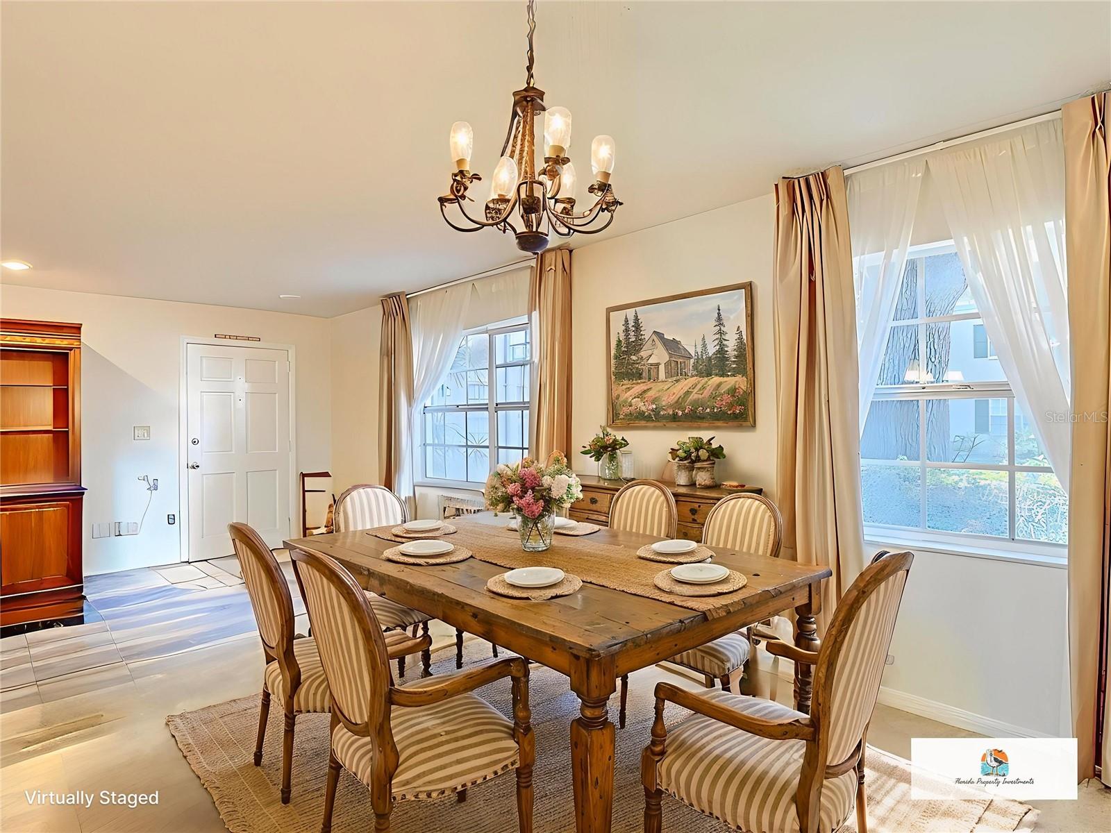 Staged front entry and dining