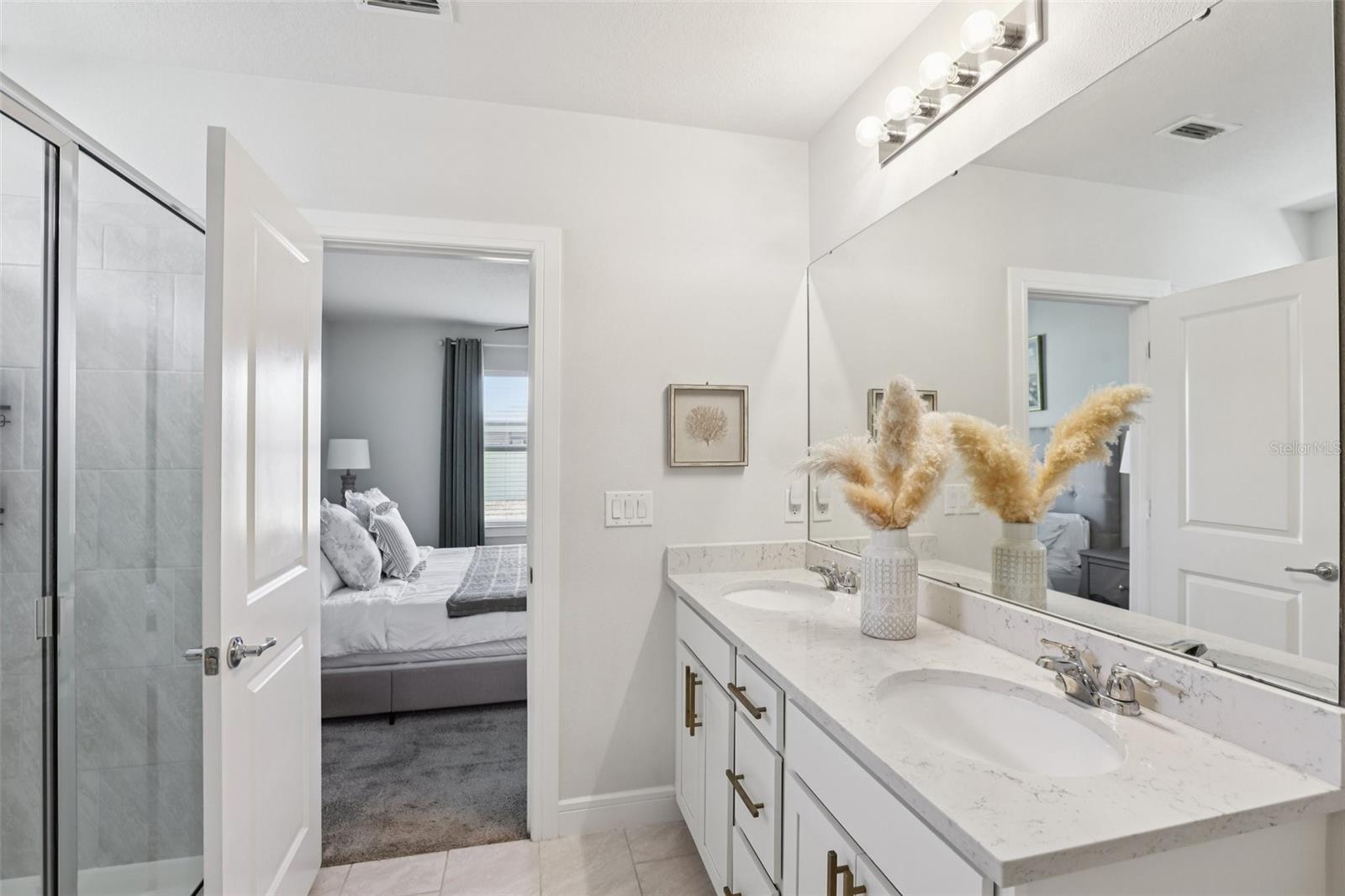 Double Sink Vanity and Walk In Glass Enclosed Shower