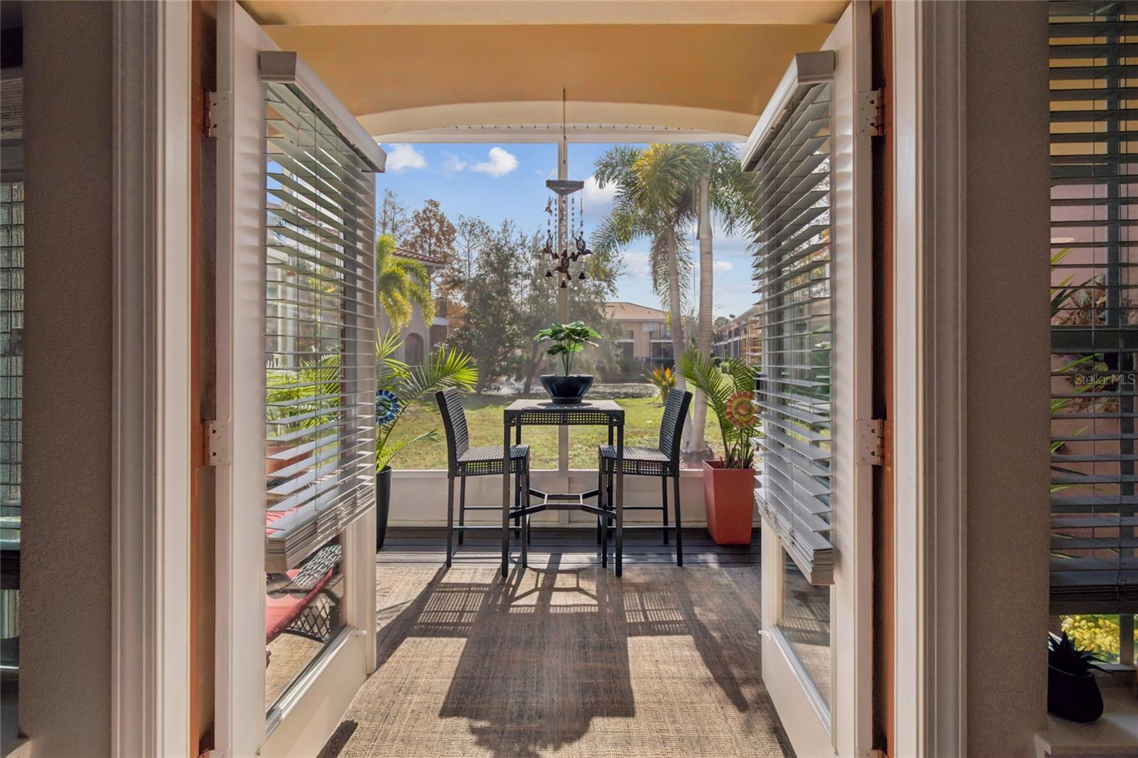 View of Pond and Fountain from front door thru Rear Screened Porch