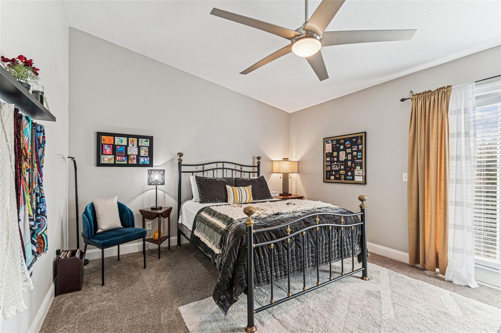 Master bedroom with open shelving, French doors leading to balcony w/ pond/fountain view. Motorized hurricane shutter.