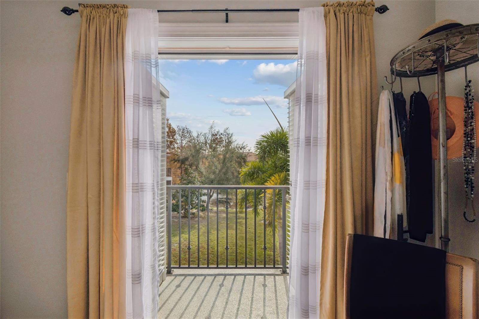 Mater bedroom French doors with pond/fountain view