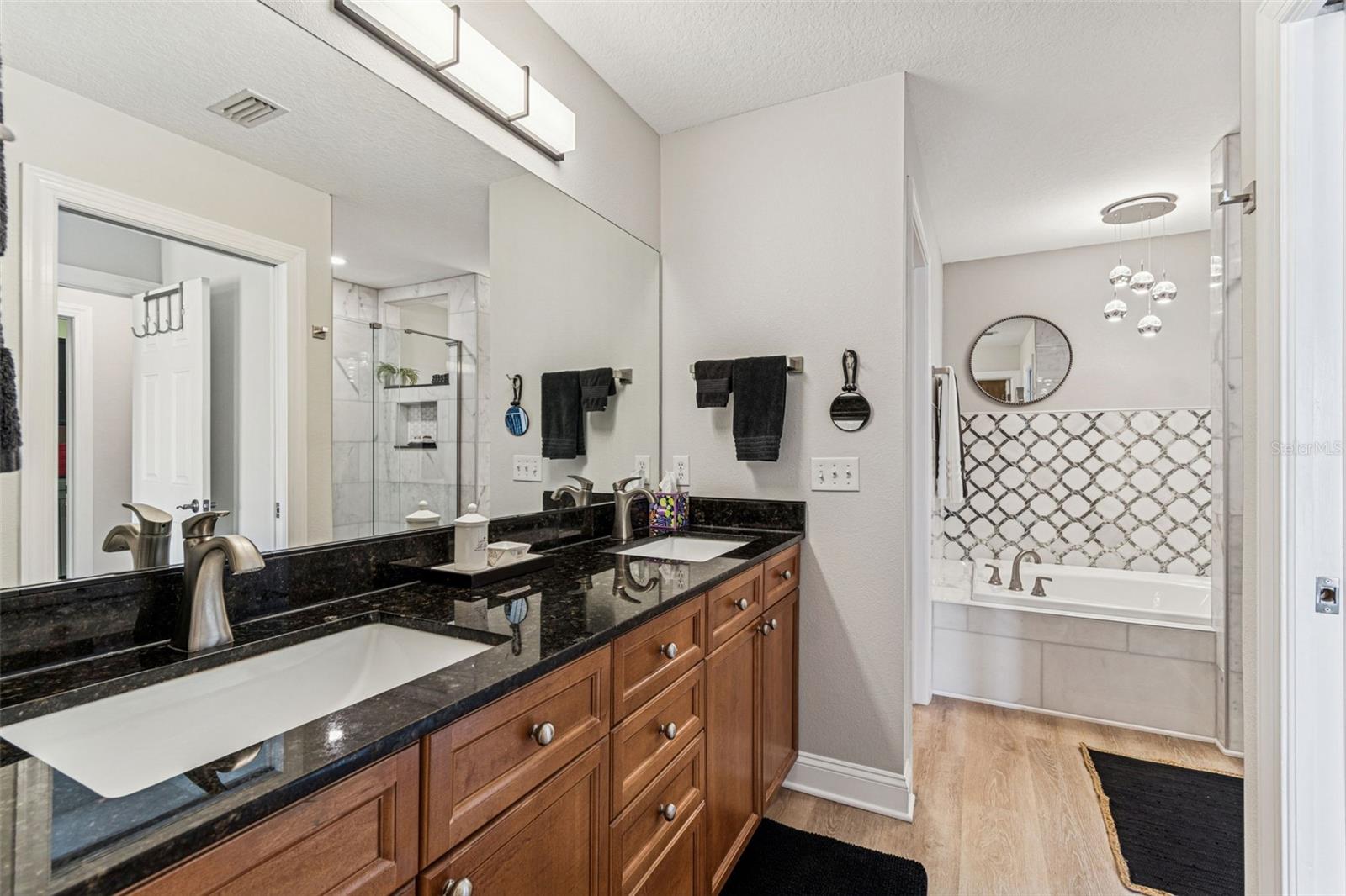 Master bath with newly remodeled soaking tub area with open shelf