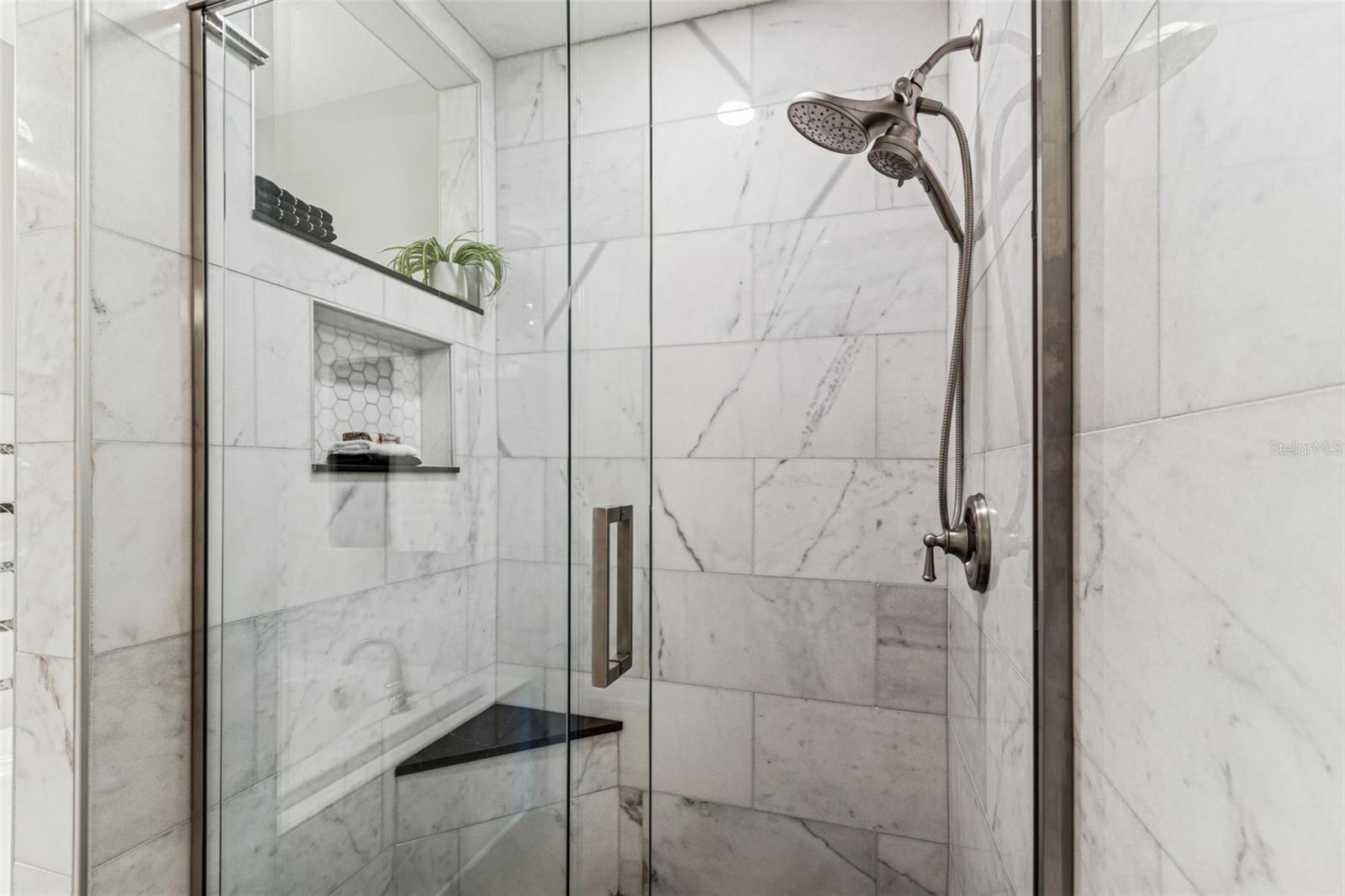 Newly remodeled porcelain shower with 2 shower heads, niche...