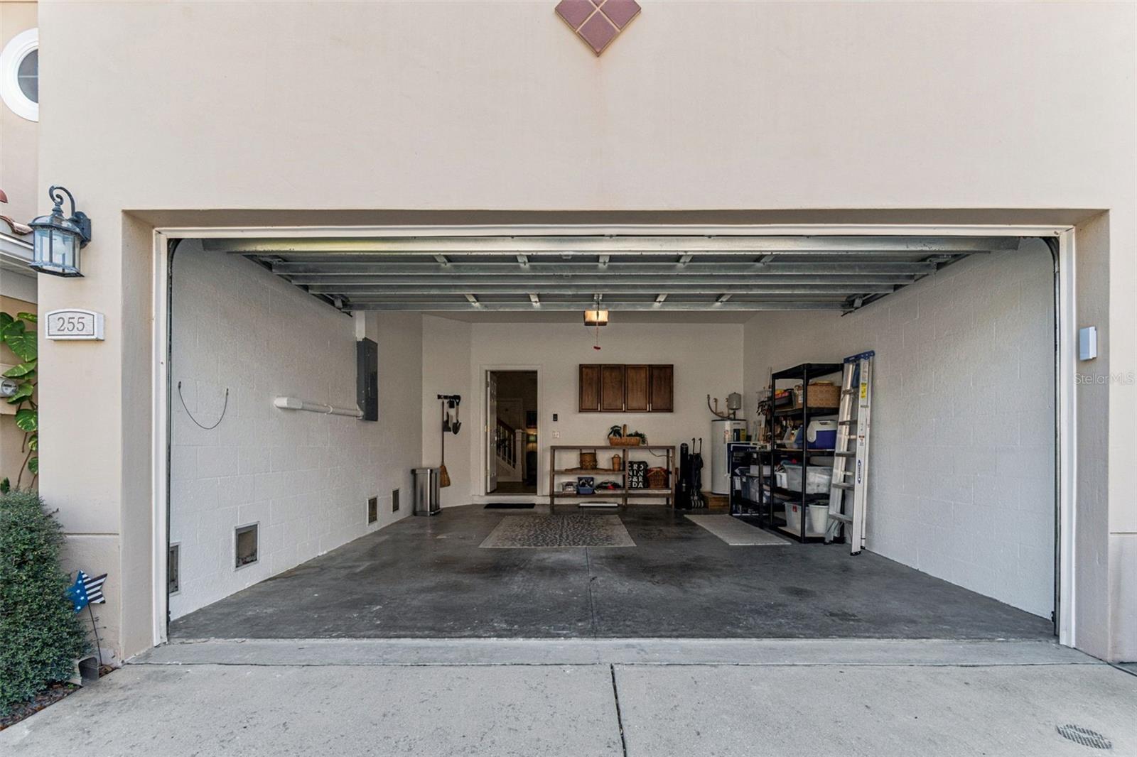 Recently painted 2 car garage with 2 work bench areas and cabinets