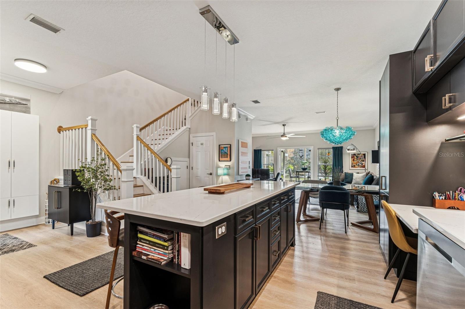 Custom quartz over-sized island w/ 4 stools, storage, book/pet stations