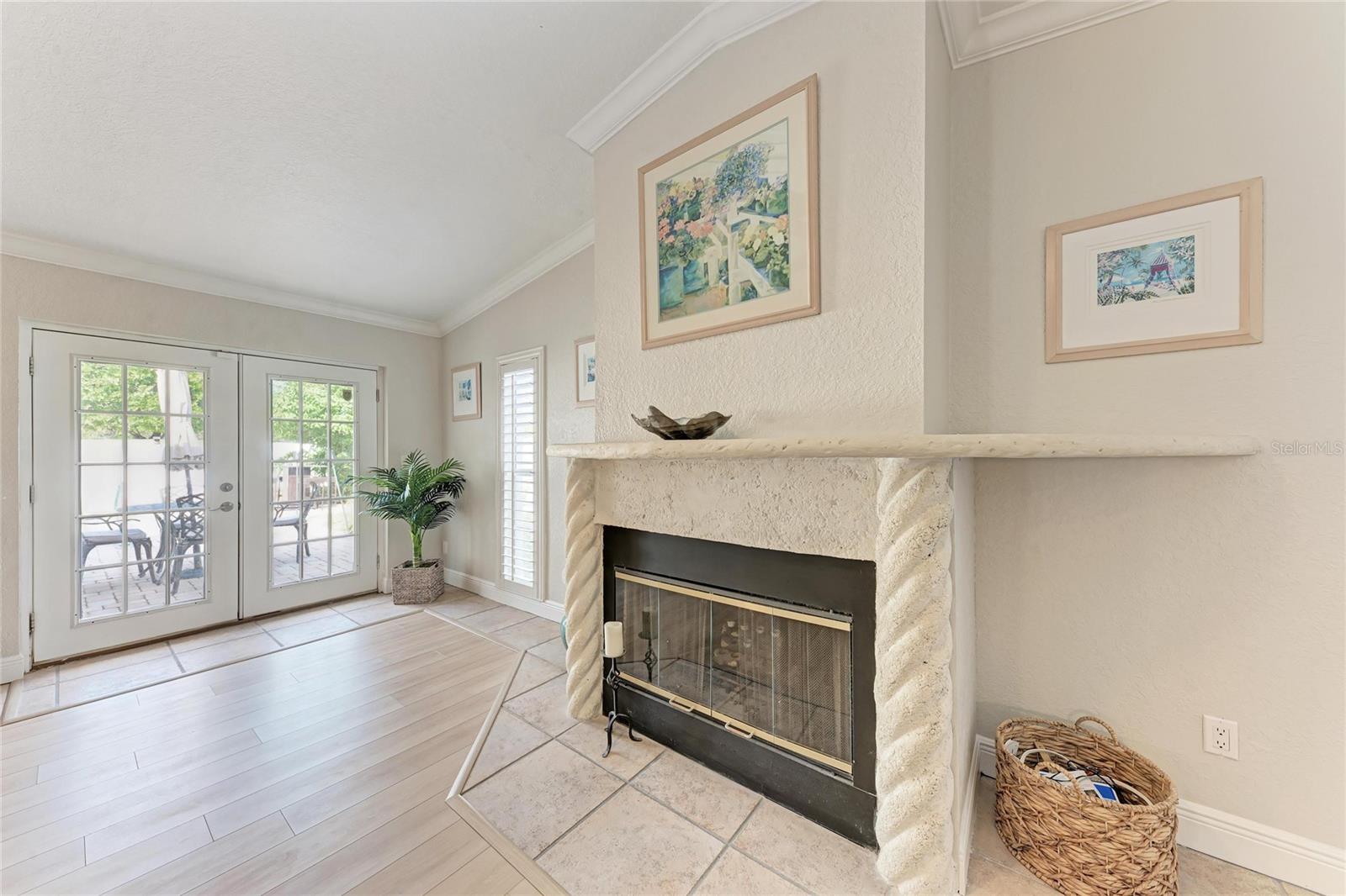 Fireplace and french doors out to your pool
