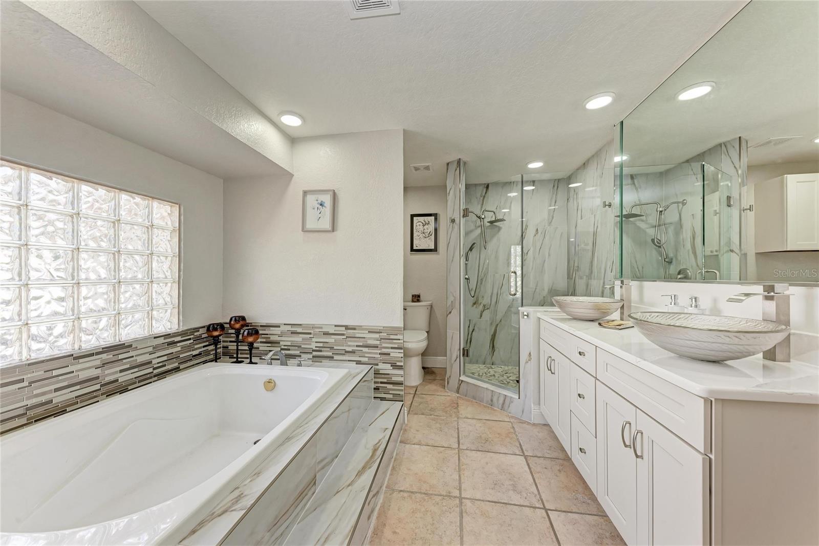 Primary bathroom with custom walk-in closet