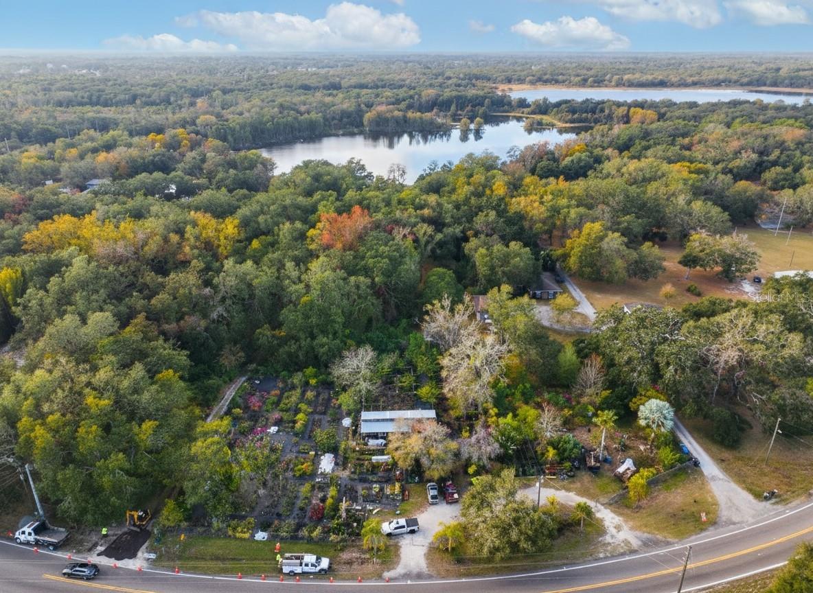 Lake Frontage Single Family Home adjacent to 3 additional parcels currently Tampa Bay Nursery on Gunn Highway