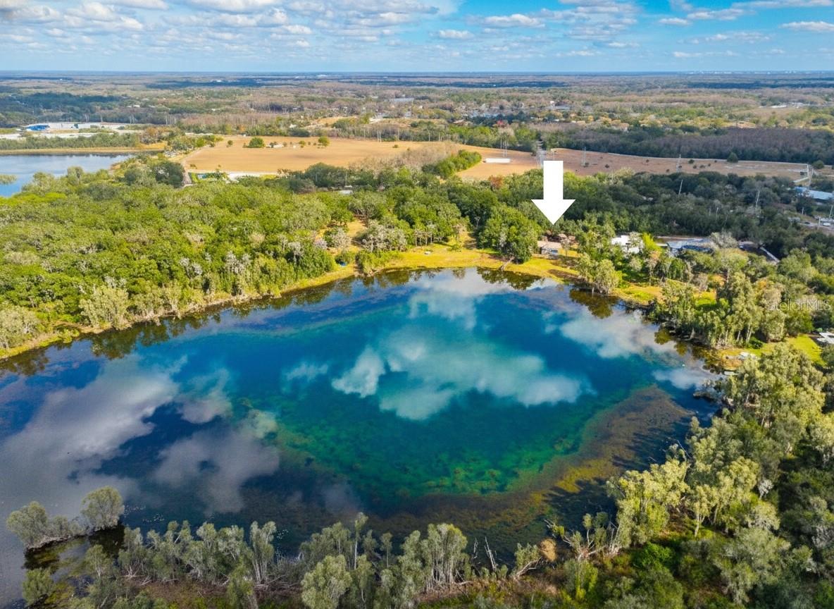 Single Family home on Lake Raleigh. Appx 18 Acre Spring Fed Lake