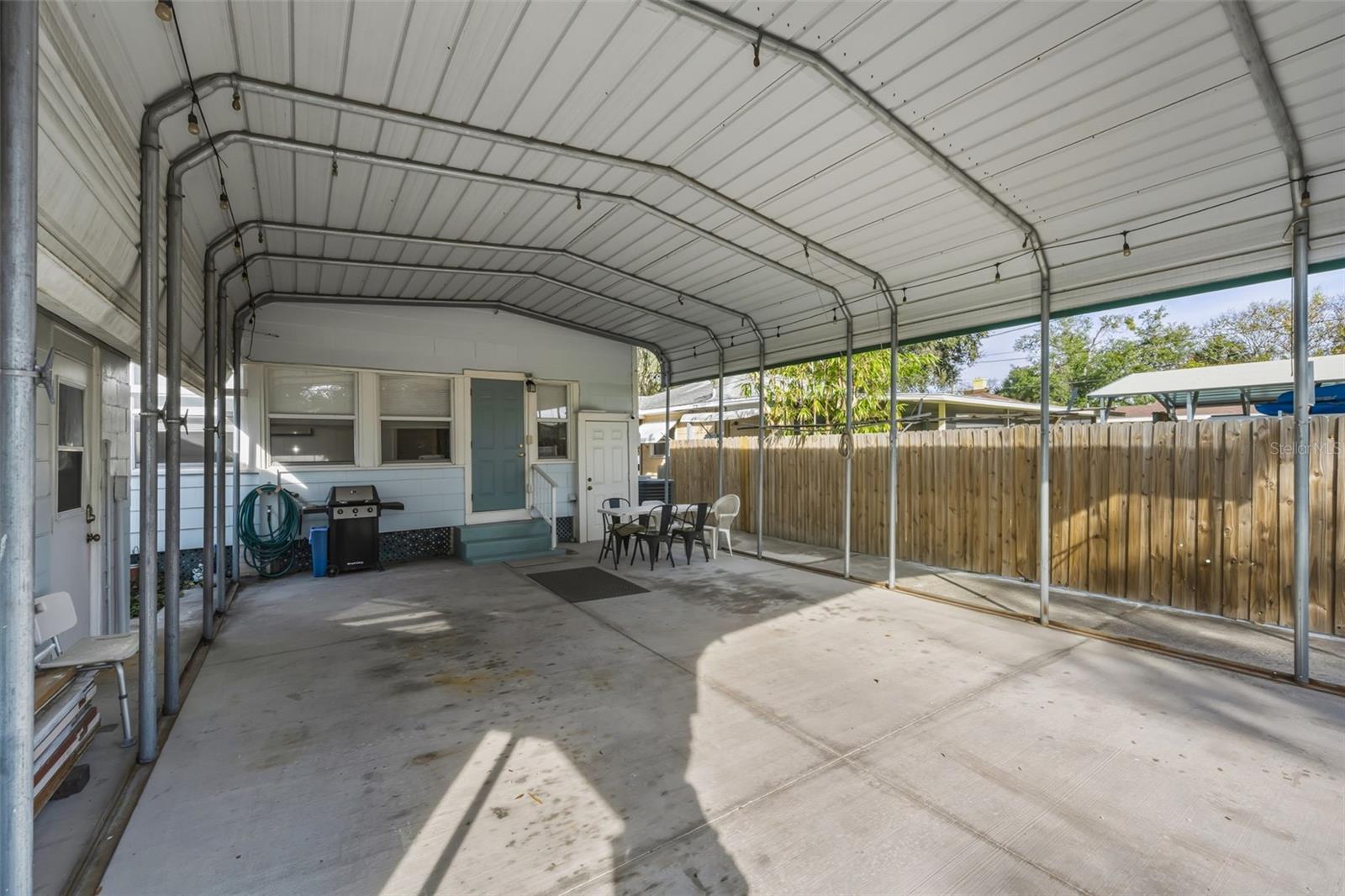 Carport provides Carport/storage/entertaining area in the shade