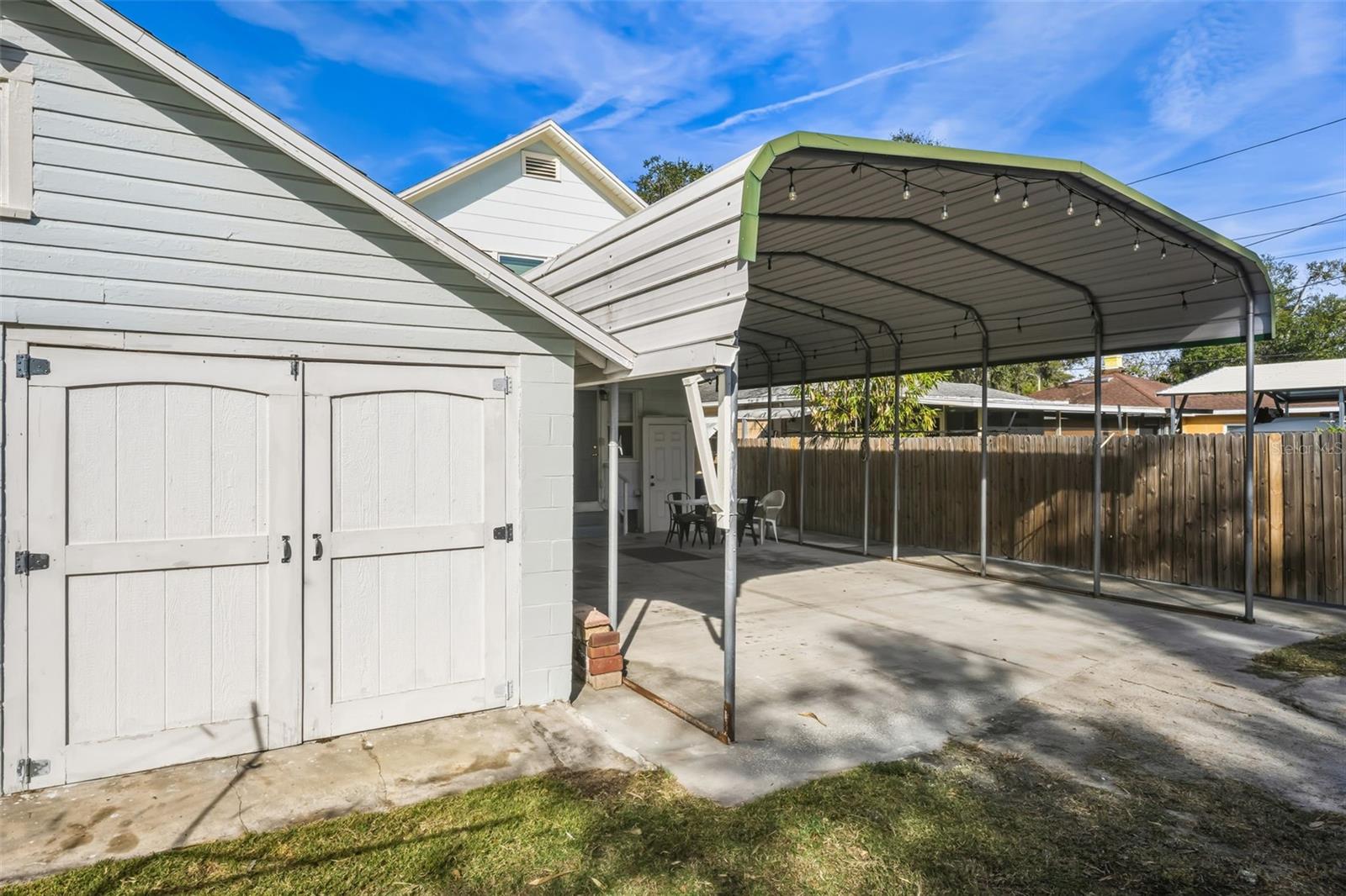 Detached 2 car garage and 4 car carport with alley access
