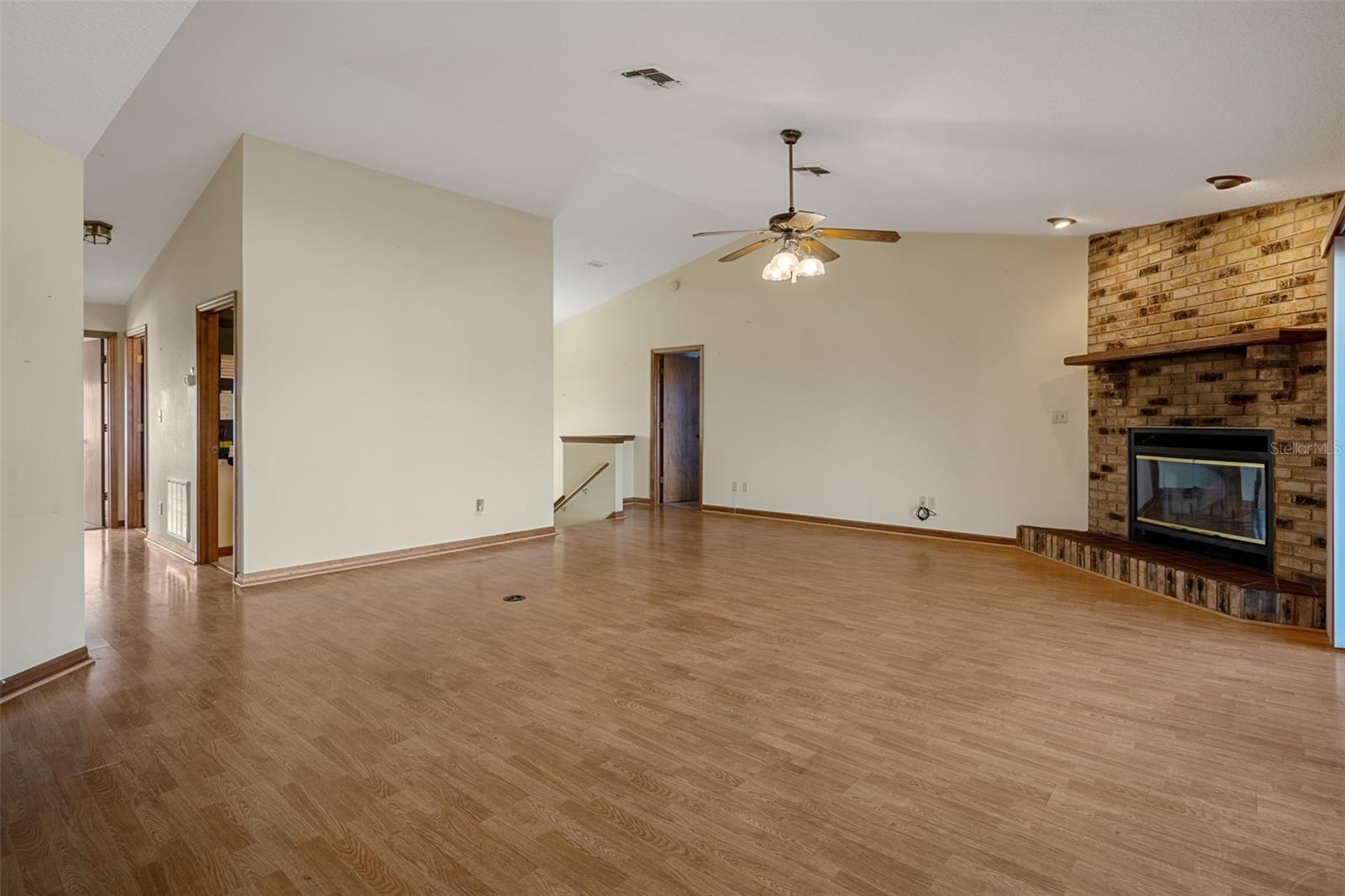 Spaciuos Living Room with Wood Burning Fireplace