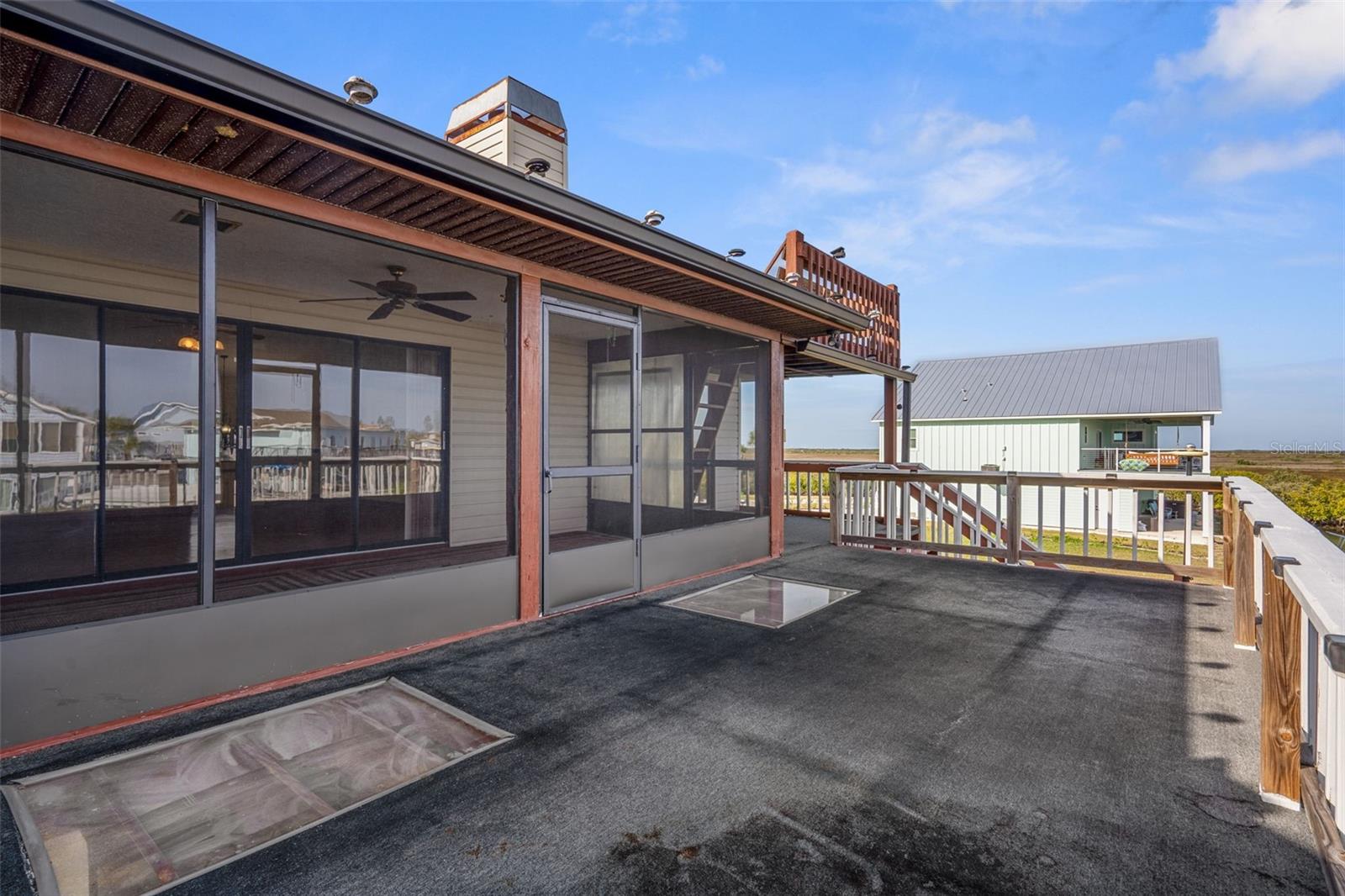 Upper Open Lanai Overlooking Gulf and Canal