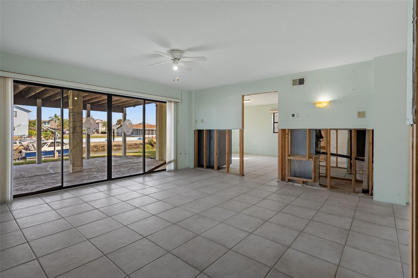 Downstairs Flex Space with Sliders to Canal