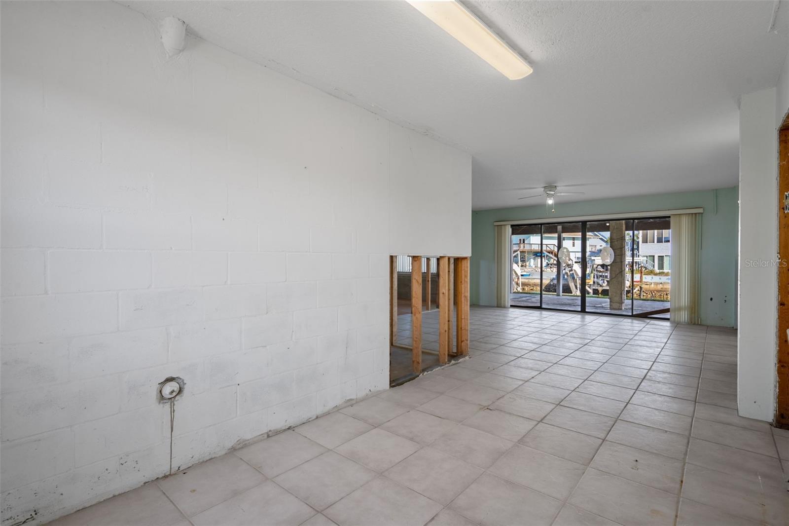 Downstairs Flex Space with Sliders to Canal