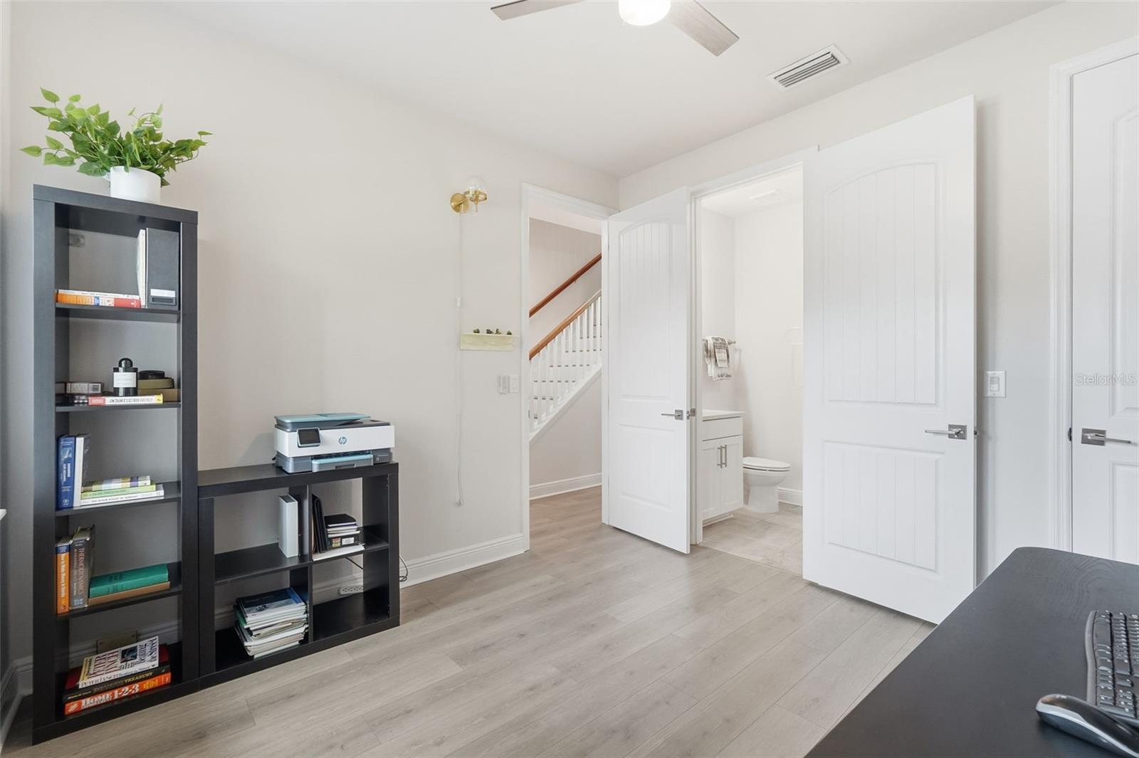 First floor bedroom suite with walk in closet and full bathroom, perfect for an office or multigenerational living.