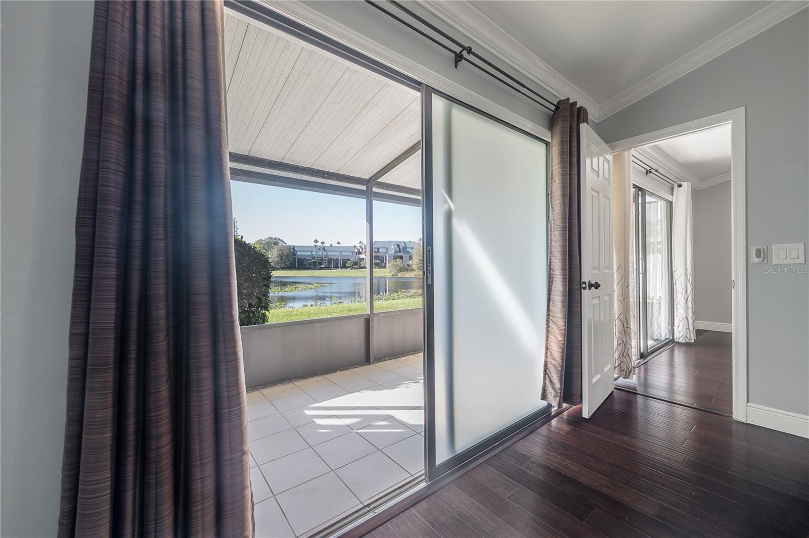 Primary Bedroom Sliders leading to the rear patio