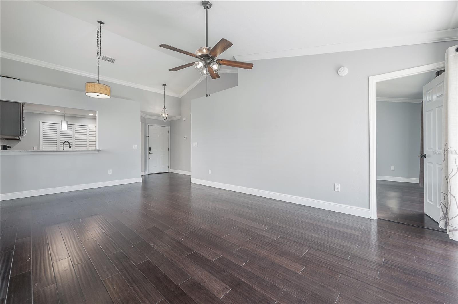 Livingroom Facing Kitchen, Front Entrance & Primary Bedroom