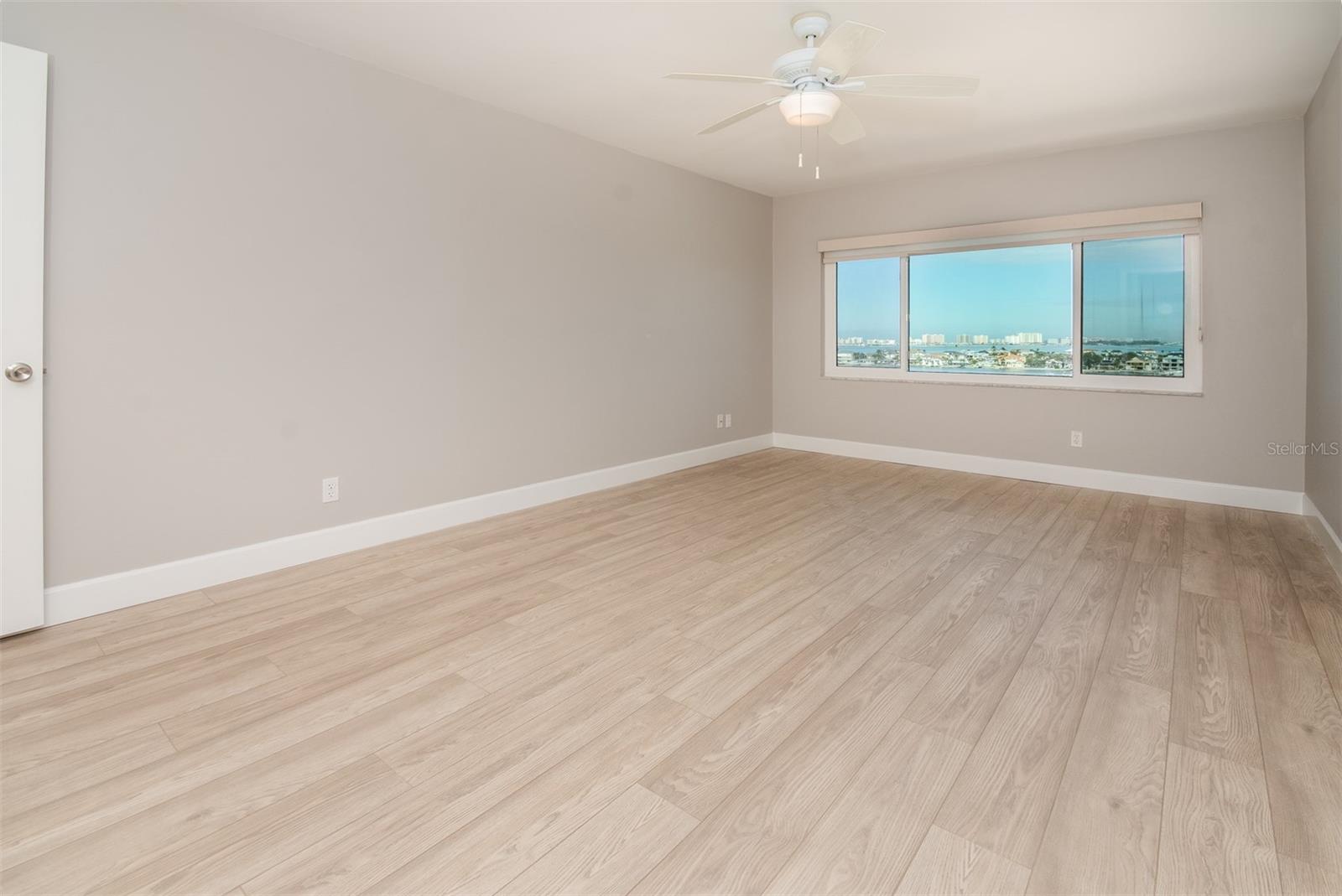 Guest Bedroom, Ceiling Fan, New Paint, New Flooring, Walk-in closet and stunning water views.