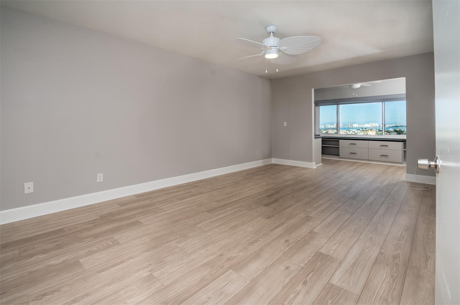 Primary bedroom with fresh paint and flooring! Stunning Water views from you home office/bonus room!