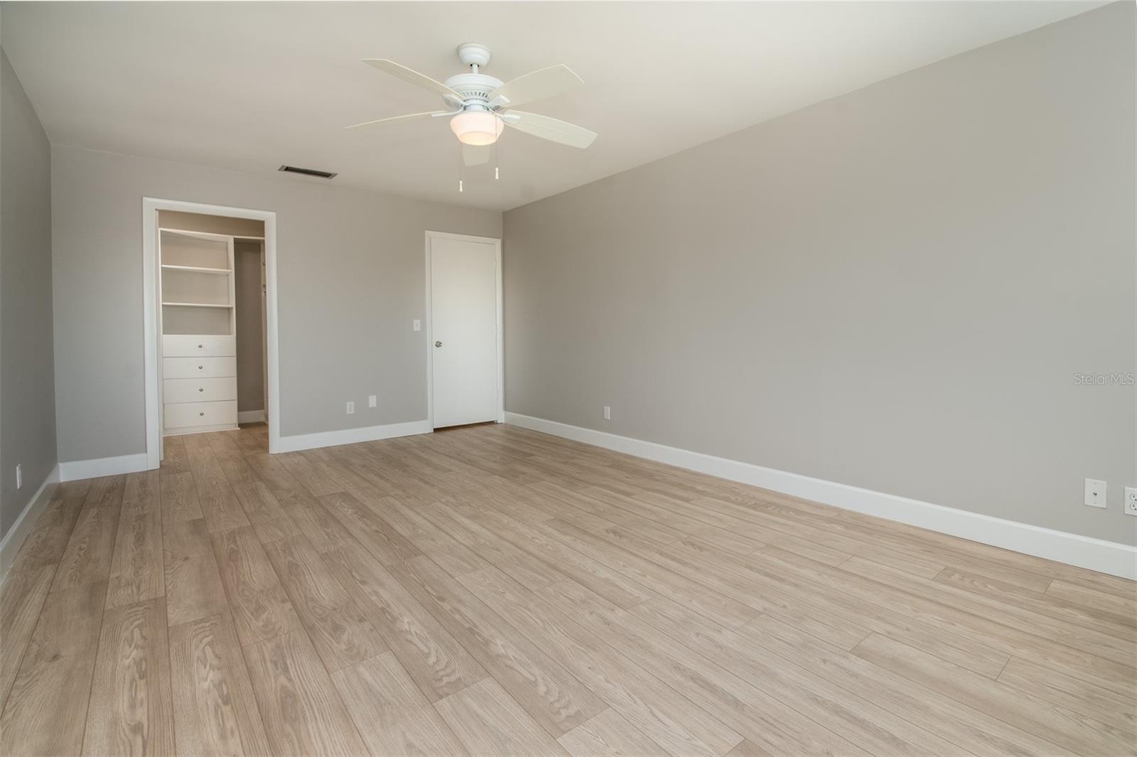 Primary bedroom with new paint and flooring!