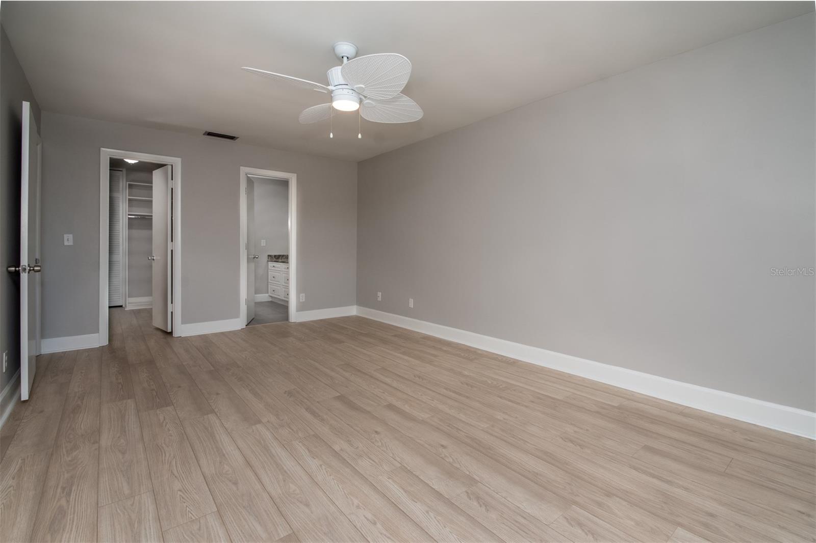 Primary bedroom with new paint and flooring!
