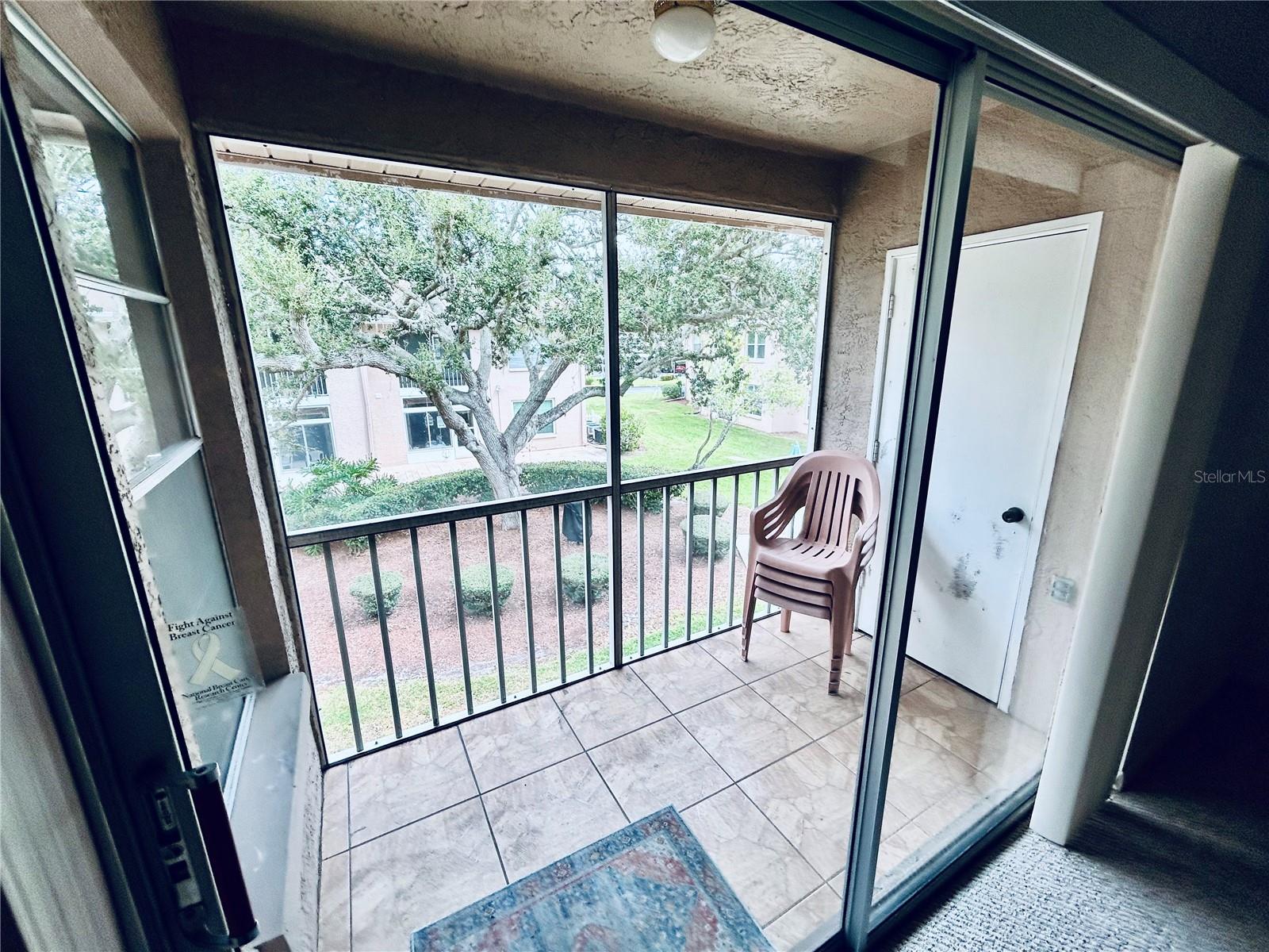 Screened in lanai looking over the courtyard