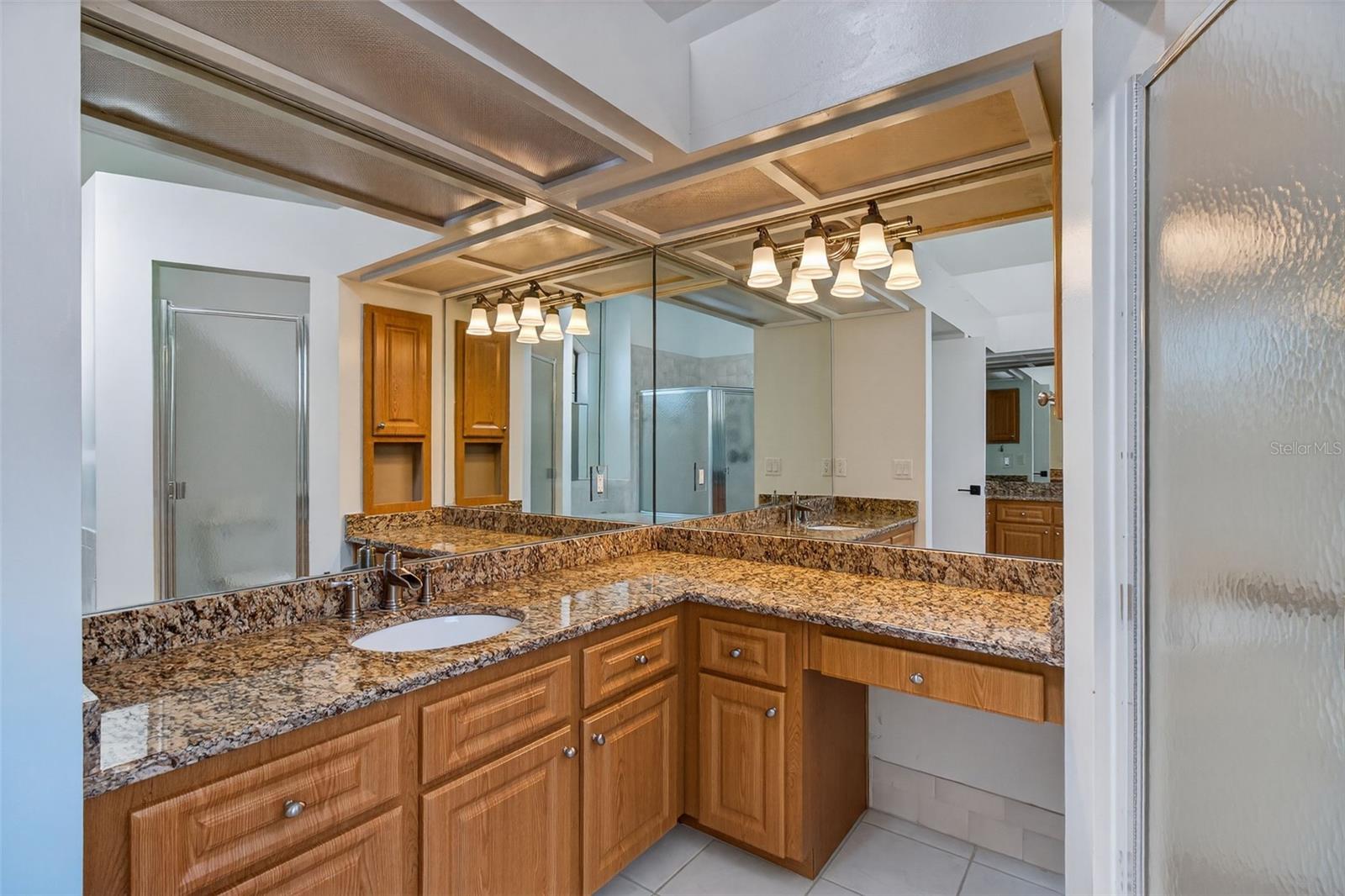 Primary bathroom with tons of vanity space .