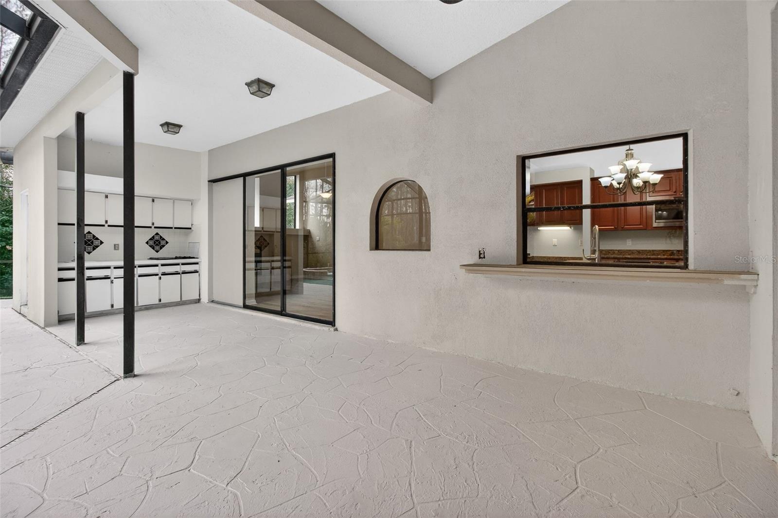 Large covered outdoor area with kitchen area.