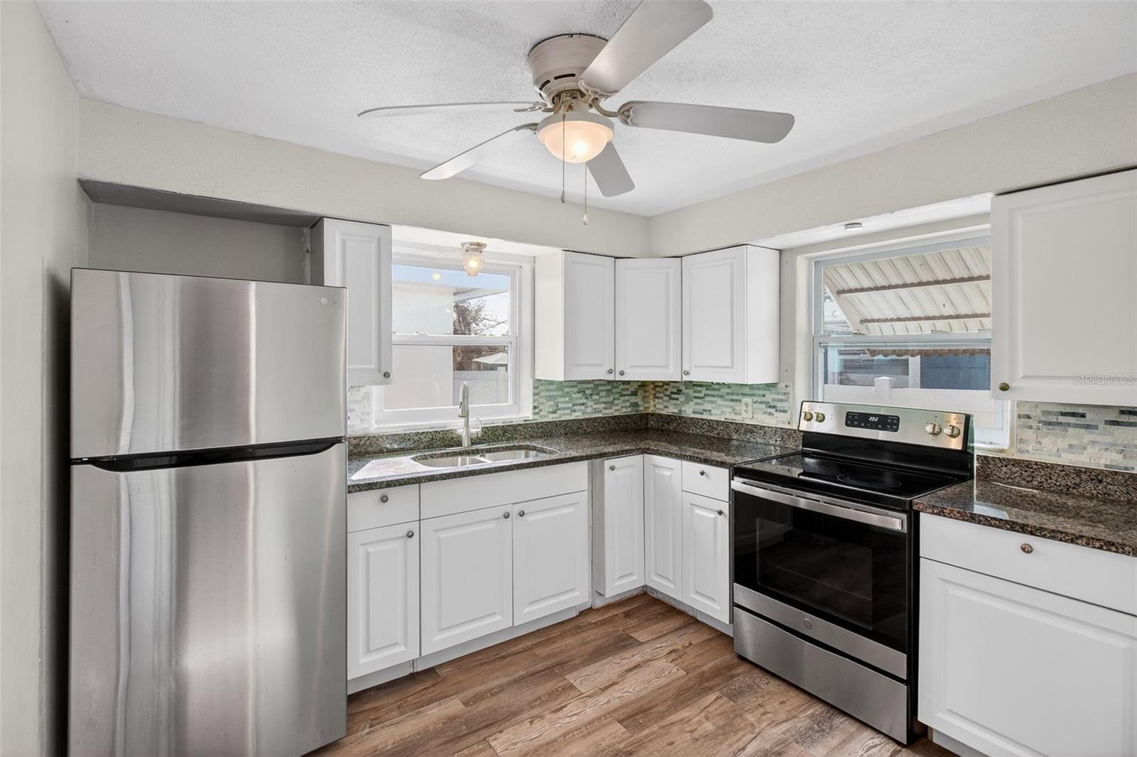 Kitchen with new appliances, new cabinets and quartz counter tops