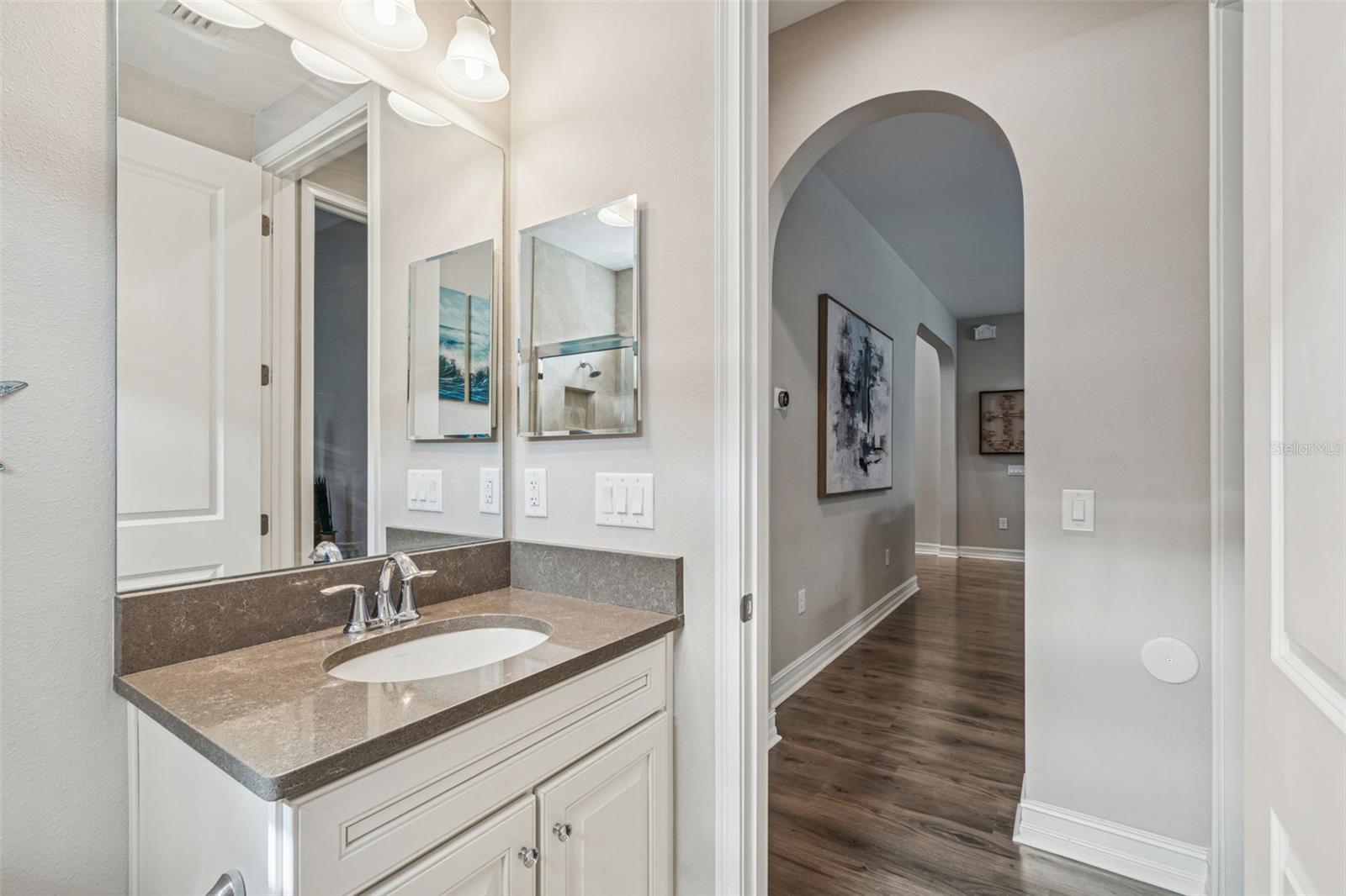 First-floor bathroom with walk-in shower just outside the guest bedroom