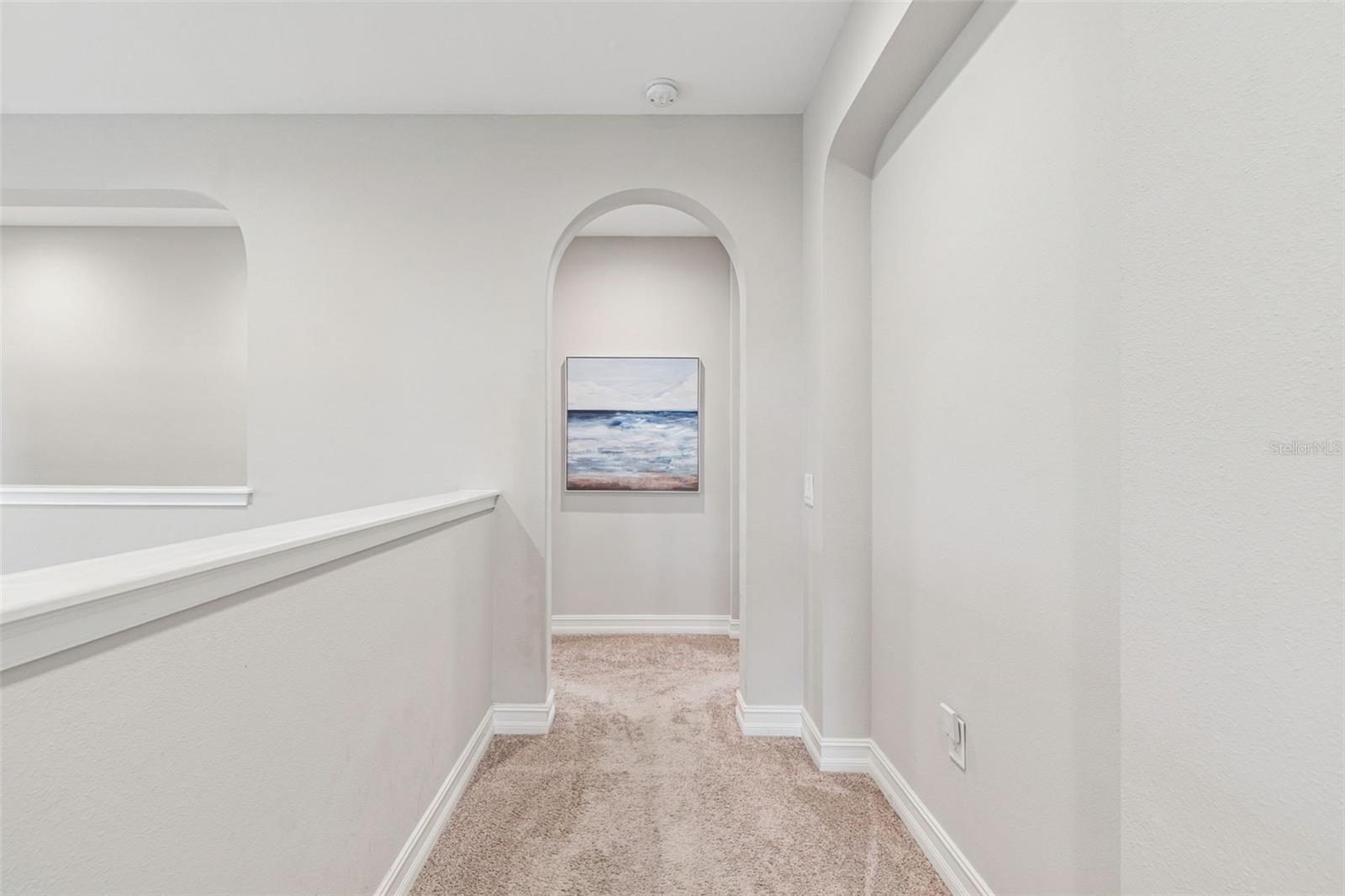 Hallway leading to primary suite