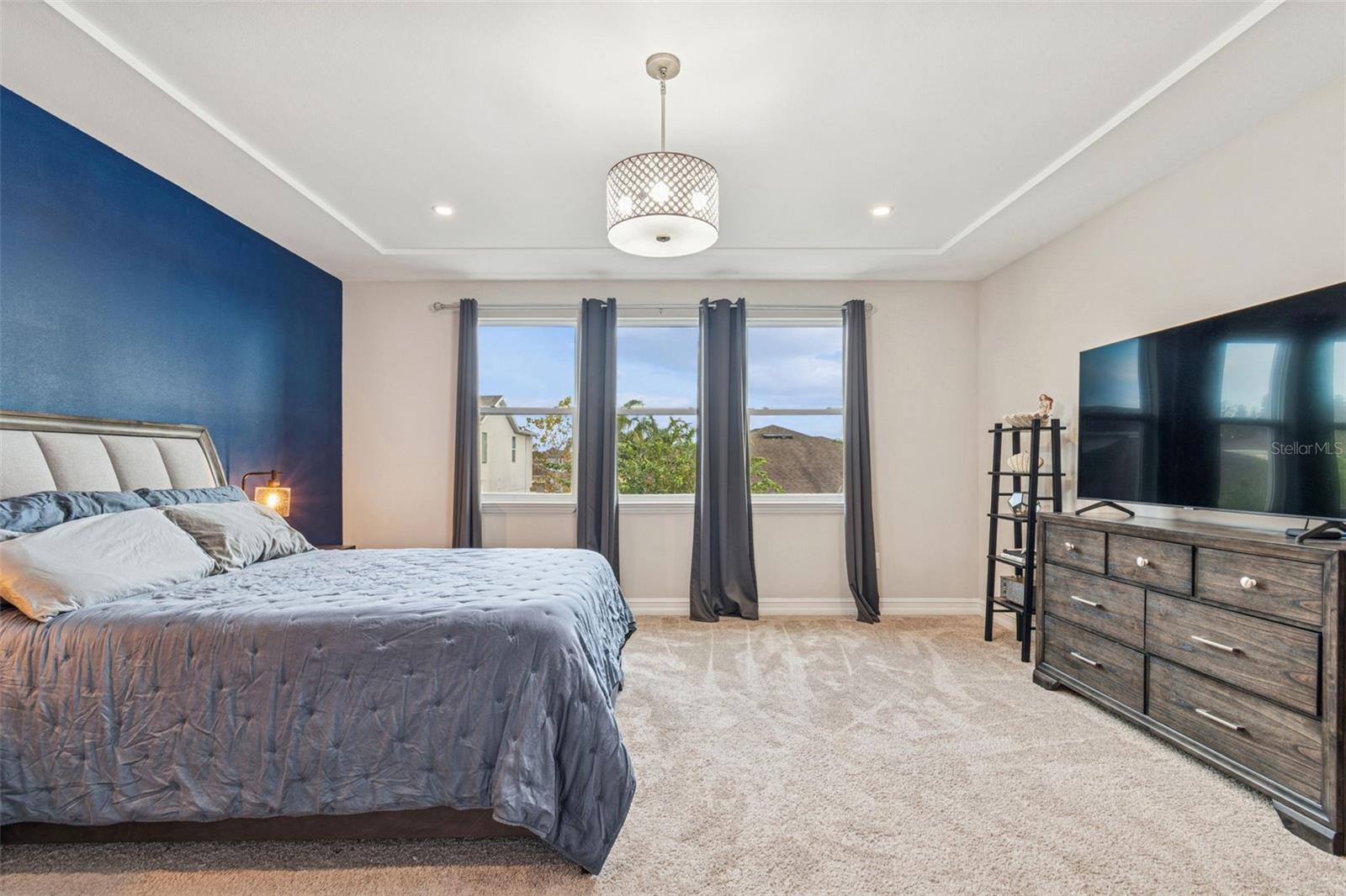 Spacious primary bedroom with expansive walk-in closet